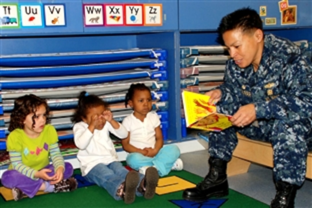 U.S. Navy Capt. Bette Bolivar reads the book "Hands Are Not for Hitting" by Martine Agassi to pre-school children at the Naval Weapons Station Yorktown Child Development Center in Yorktown, Va., April 22, 3009. Bolivar, commanding officer of Naval Weapons Station Yorktown, visited the center during one of many events in April to mark the Month of the Military Child.