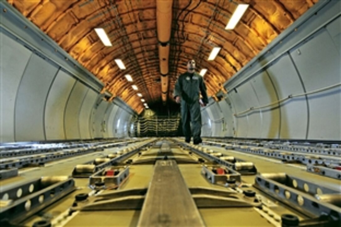 U.S. Air Force Senior Airman Pavel Del Monte walks to the rear of a KC-10 Extender to prepare for inbound fighter jets needing fuel during Red Flag-Alaska, a training exercise, on Eielson Air Force Base, Alaska, April 22, 2009. Del Monte is assigned to the 6th Air Refueling Squadron, Travis Air Force Base, Calif.