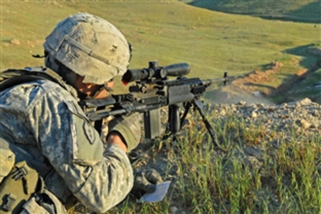 A U.S. Army soldier uses long-range marksmanship techniques to engage steel targets with an M-14 enhanced battle rifle during a four-day marksmanship course on Forward Operating Base Marez in Mosul, Iraq, April 13, 20009. The soldiers are assigned to 1st Cavalry Division's Company A, 3rd Brigade Combat Team.