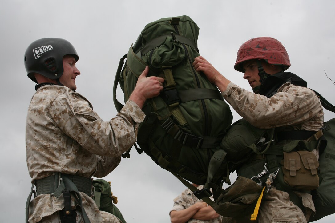 CAMP PENDLETON, Calif. - Marines with the 1st Radio Battalion prepare their gear for parachuting here  April 23, 2009.  The training will prepare the Marines for an upcoming deployment with the 11th Marine Expeditionary Unit later this year. (U.S. Marine Corps photo by Lance Cpl. Preston Reed) (Released)