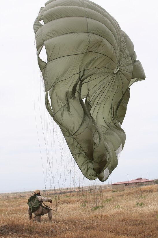 CAMP PENDLETON, Calif. - A Marine with the 1st Radio Battalion recovers after parachuting from a CH-46 Sea Knight helicopter here  April 23, 2009.  (U.S. Marine Corps photo by Cpl. Shawn M. Spitler) (Released)