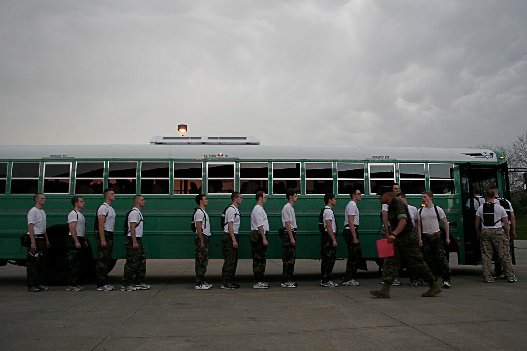 Marine Officer Candidates quickly file onto a bus during an Officer Candidate School Preparation weekend at Camp Dodge, Des Moines, Iowa, April 24. The OCS Prep weekend is designed to give candidates a glimpse into what OCS life is like.