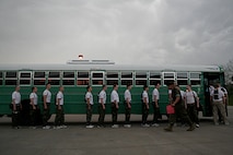 Marine Officer Candidates quickly file onto a bus during an Officer Candidate School Preparation weekend at Camp Dodge, Des Moines, Iowa, April 24. The OCS Prep weekend is designed to give candidates a glimpse into what OCS life is like.