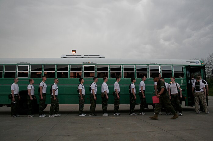 Marine Officer Candidates quickly file onto a bus during an Officer Candidate School Preparation weekend at Camp Dodge, Des Moines, Iowa, April 24. The OCS Prep weekend is designed to give candidates a glimpse into what OCS life is like.