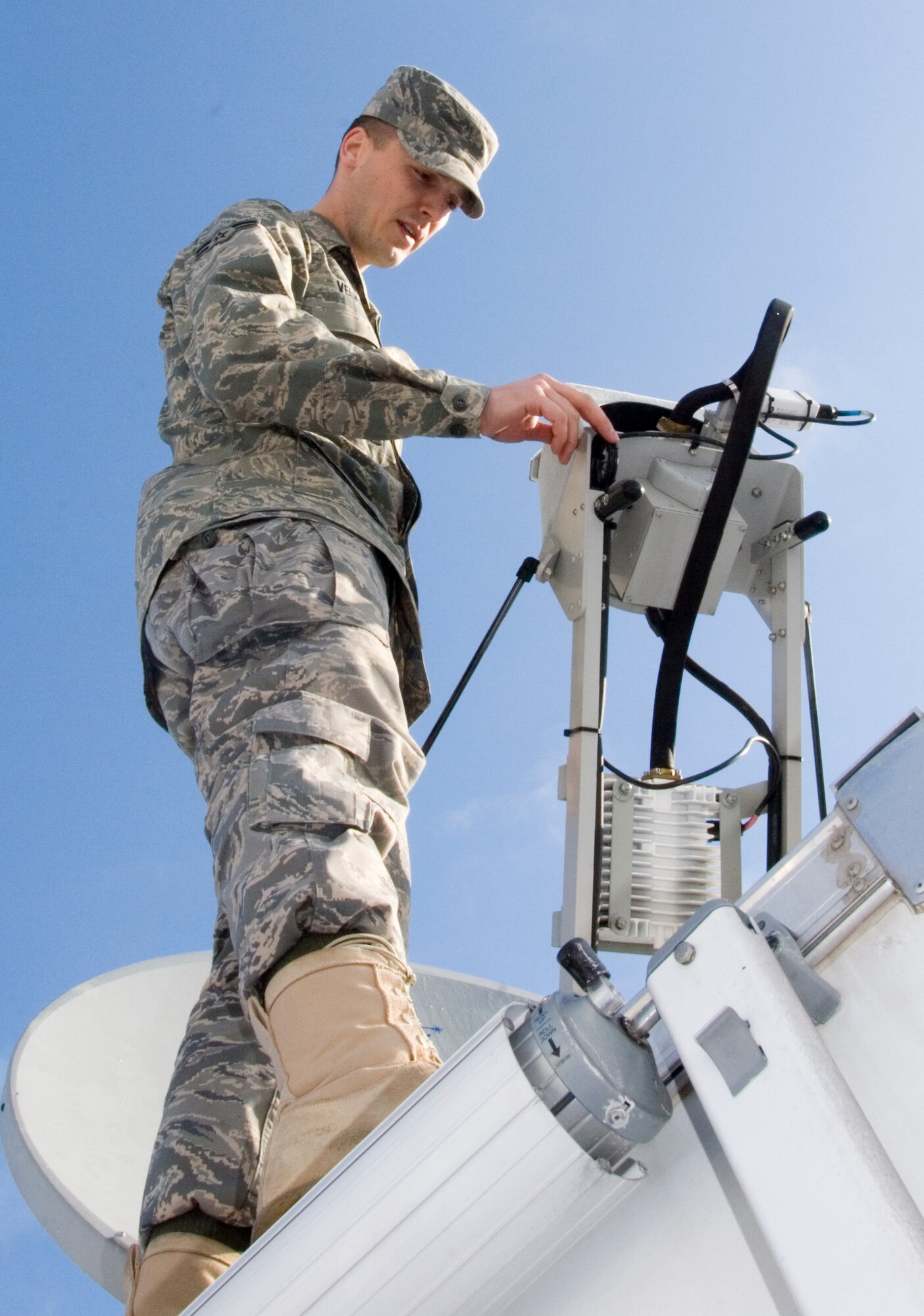 29 March 2009
Airman 1st Class Sanel Velic 133rd Communications Flight, Minnesota Air National Guard, checks the dish on a state wide military communication system near Moorhead, Minnesota. The Joint Communications Platform (JCP) allows both Army National Guard and Air National Guard members to communicate live with information about 2009 spring flooding. Airman 1st Class Velic?s hometown is St Paul, MN. 
U.S. Air Force Photo by Tech Sgt Erik Gudmundson (Released)


