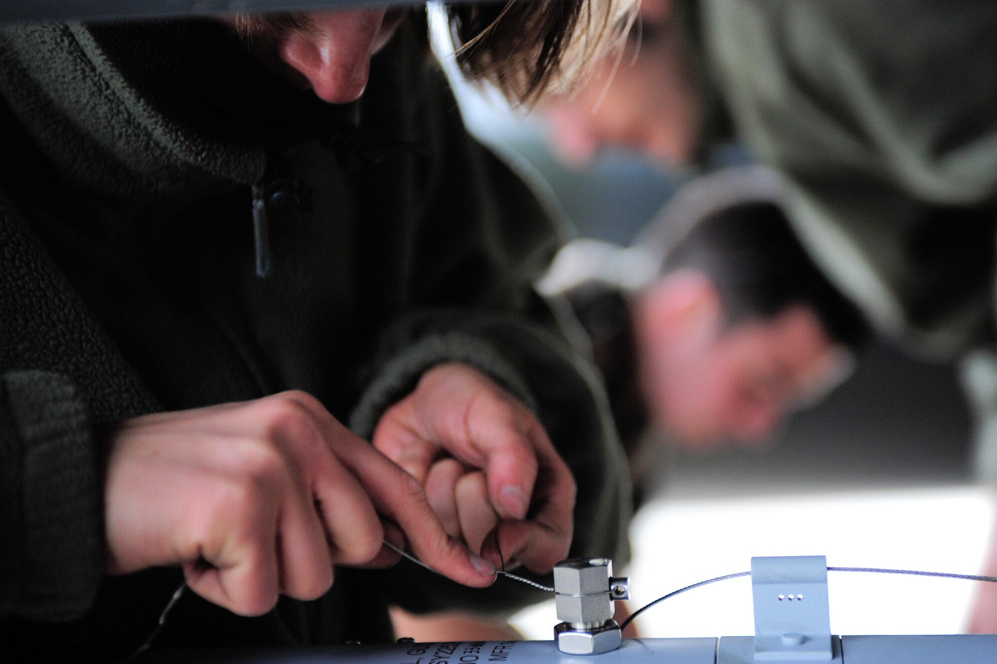 Sgt. Amandine Thevenov, French Air Force, finishes loading a Guided Bomb Unit-28 into place on a French Dassault M2000 Mirage during RED FLAG-Alaska 09-2 April 22, 2009, Eielson Air Force Base, Alaska. This exercise provides training for deployed maintenance and support personnel in sustainment of large-force deployed air operations.  (U.S. Air Force Photo/Senior Airman Jonathan Snyder)