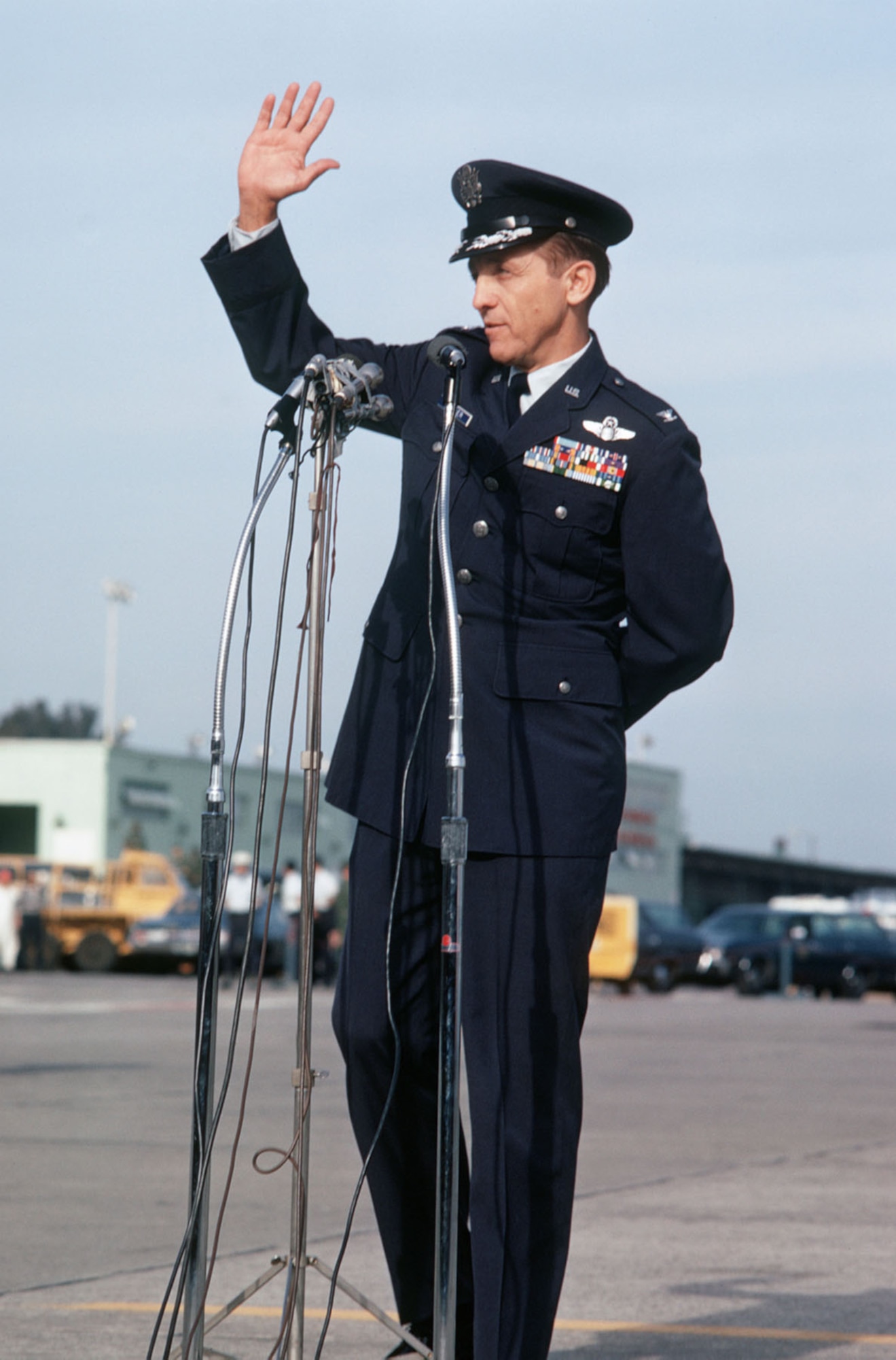 Col. Robinson Risner addresses the crowd in a new uniform. Promoted while in prison, he had been a colonel for several years, but he had never worn his new rank. (U.S. Air Force photo)