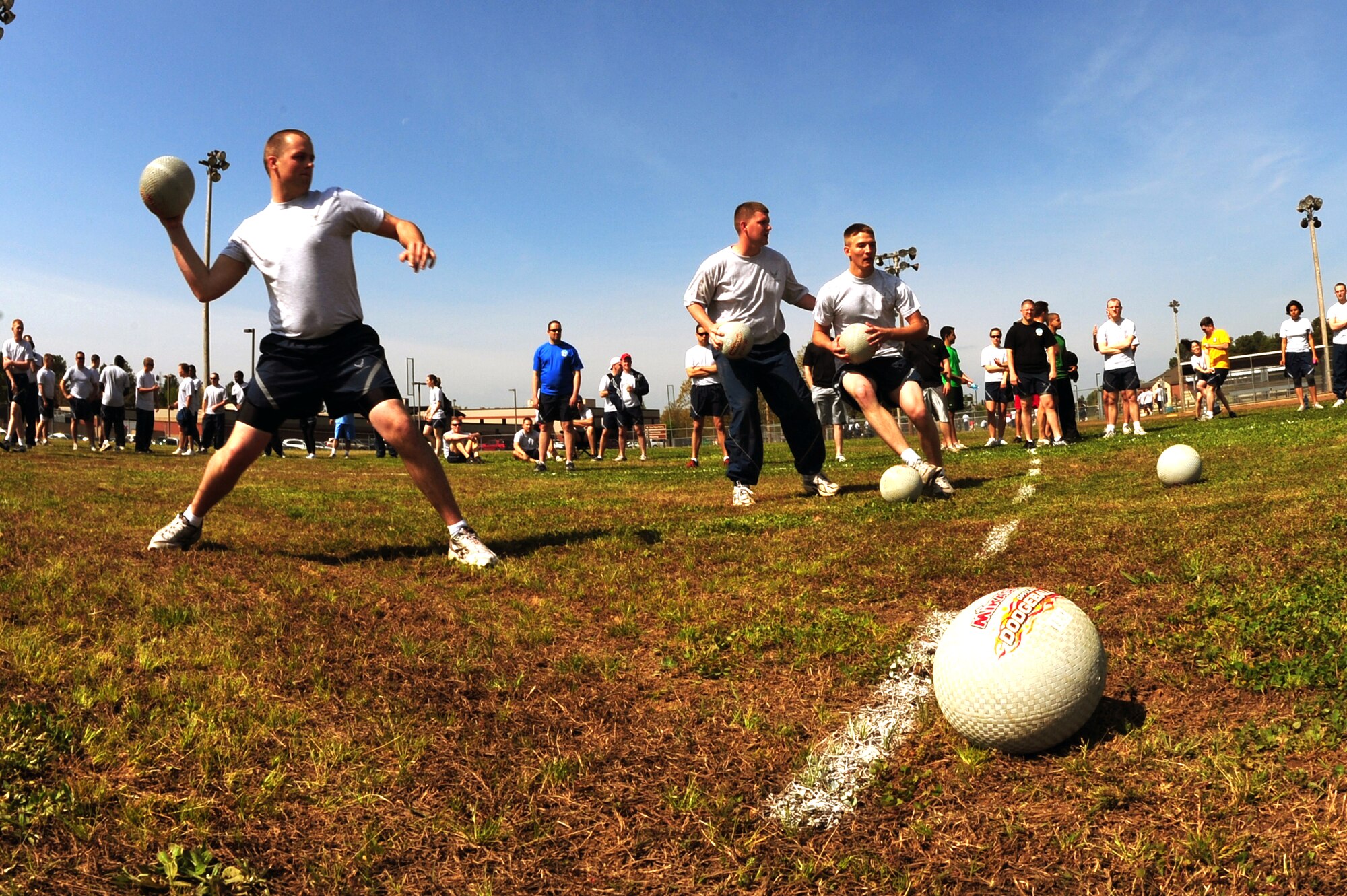 Airmen battle for victory during  the Little Rock Air Force Base “Fit to Fight Sports Day” dodgeball tournament April 17, 2009. The Little Rock AFB Sports Day is a biannual event designed to celebrate fitness and increase the morale of personnel stationed here. (U.S. Air Force photo by Senior Airman Steele Britton)