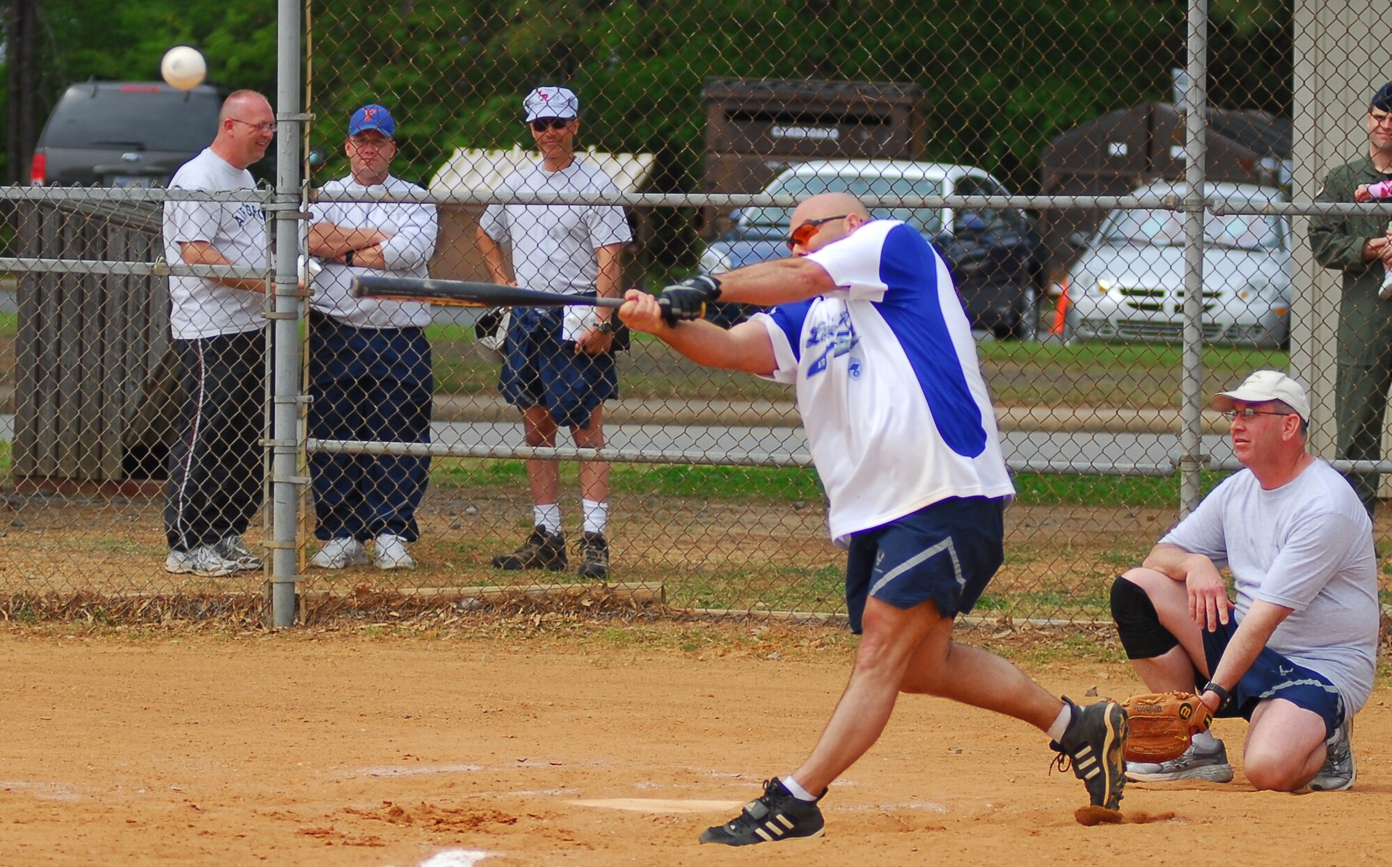 Chief Master Sgt. Kevin Inskeep, 314th Maintenance Group Superintendent, crushes a softball during the "Chiefs vs. Eagles" exhibition softball game at Little Rock Air Force Base April 17, 2009 as part of the “Fit to Fight Sports Day” events. The Little Rock AFB Sports Day is a biannual event designed to celebrate fitness and increase the morale of personnel stationed here. (U.S. Air Force photo by Staff Sgt. Juan Torres)