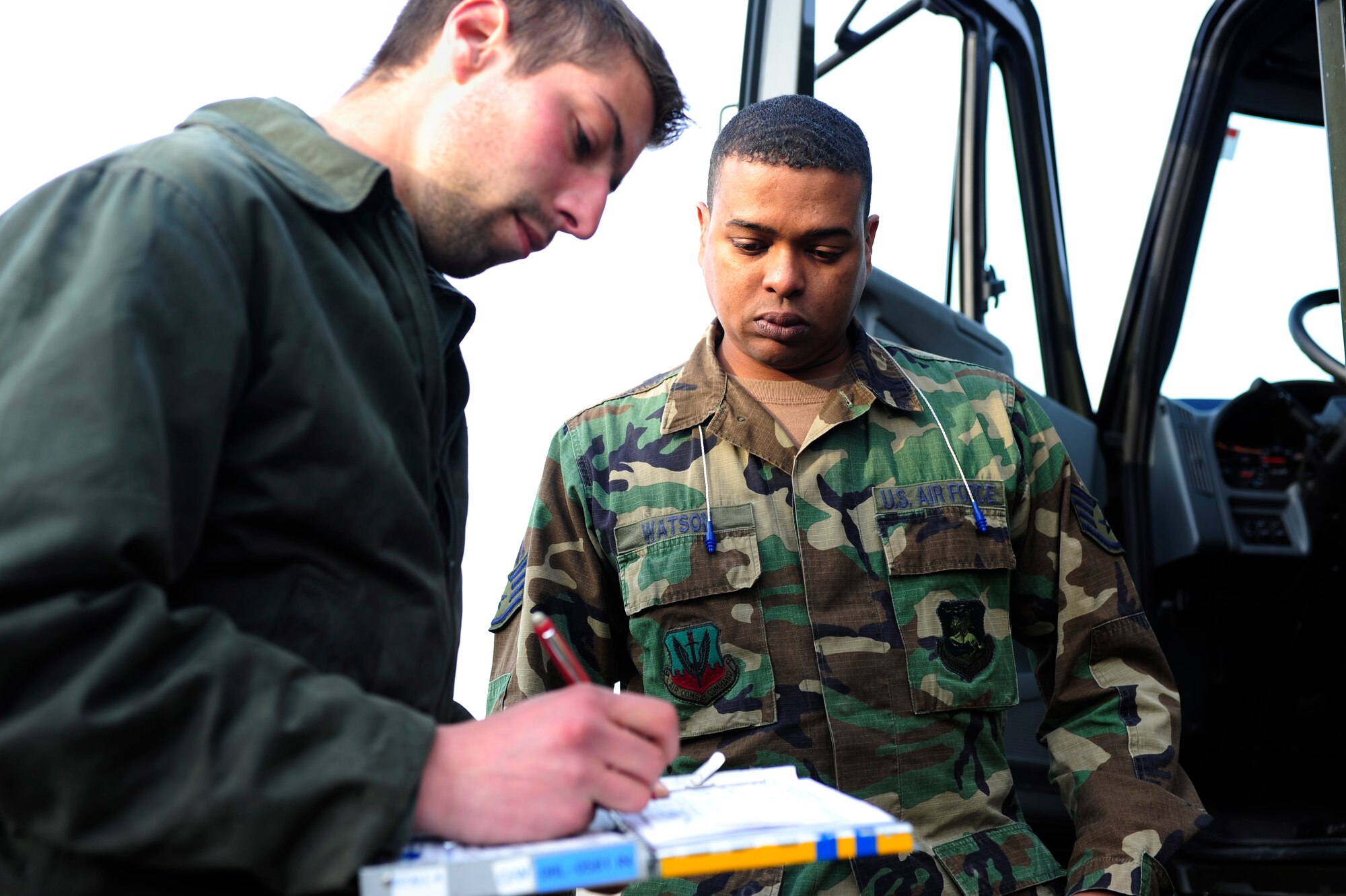 Staff Sgt. Termar Watson, right, 132nd Logistic Readiness Squadron, Des Moines Air National Guard, Iowa, and Staff Sgt. Michael Iggiotti, left, French Air Force,  work together while refueling several French Dassault M2000 Mirage during RED FLAG-Alaska 09-2 April 22, 2009, Eielson Air Force Base, Alaska. This exercise provides training for deployed maintenance and support personnel in sustainment of large-force deployed air operations.  (U.S. Air Force Photo/Senior Airman Jonathan Snyder)