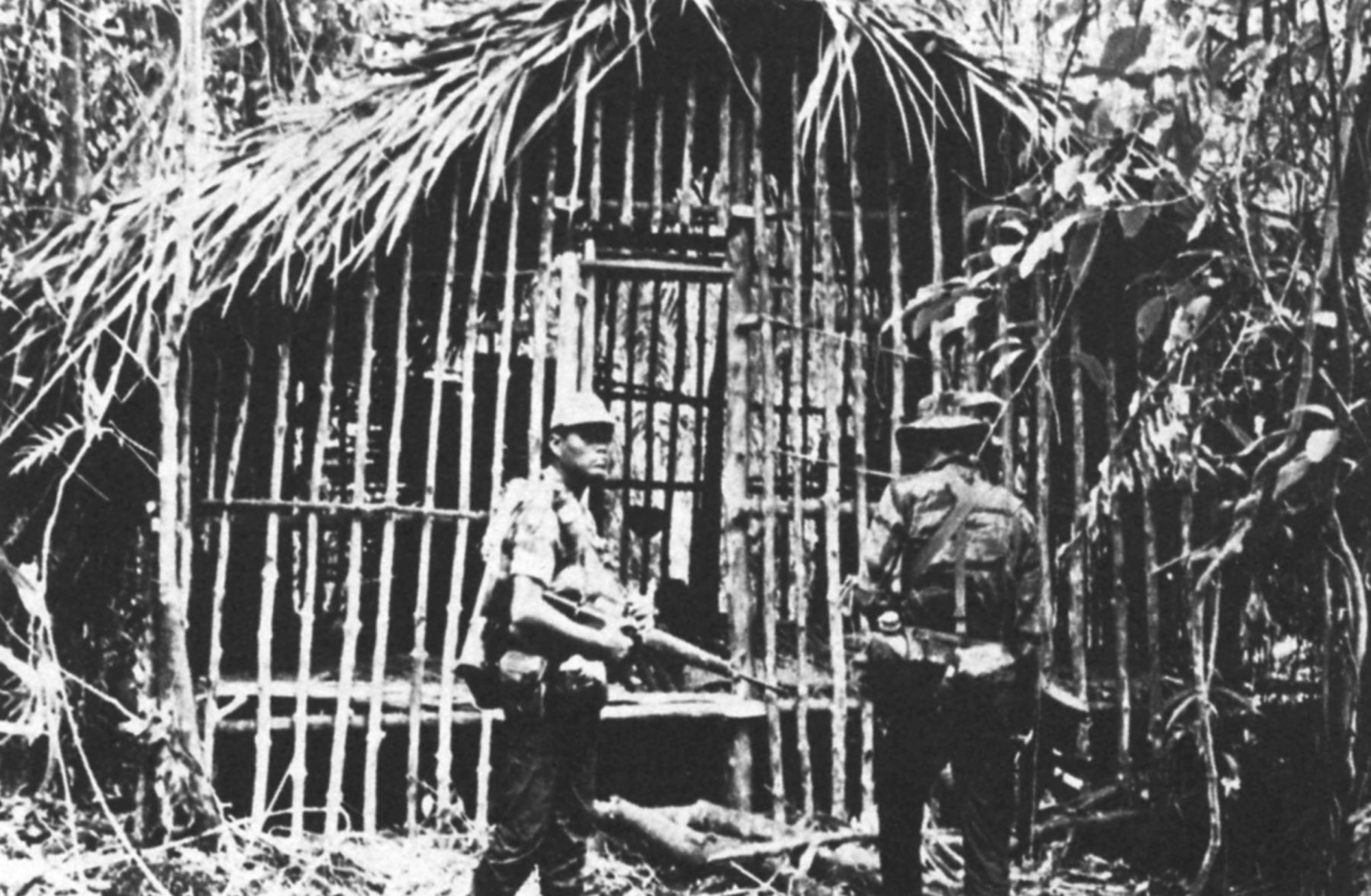 POWs in South Vietnam, held by Viet Cong guerillas, were typically held in cages or huts, or were fully exposed to the steaming jungle weather and insects. They usually had inadequate food, water and medicine. Prisoners in Laos and Cambodia faced similar hardships where the environment, disease, and constant movement multiplied their suffering. (U.S. Air Force photo)