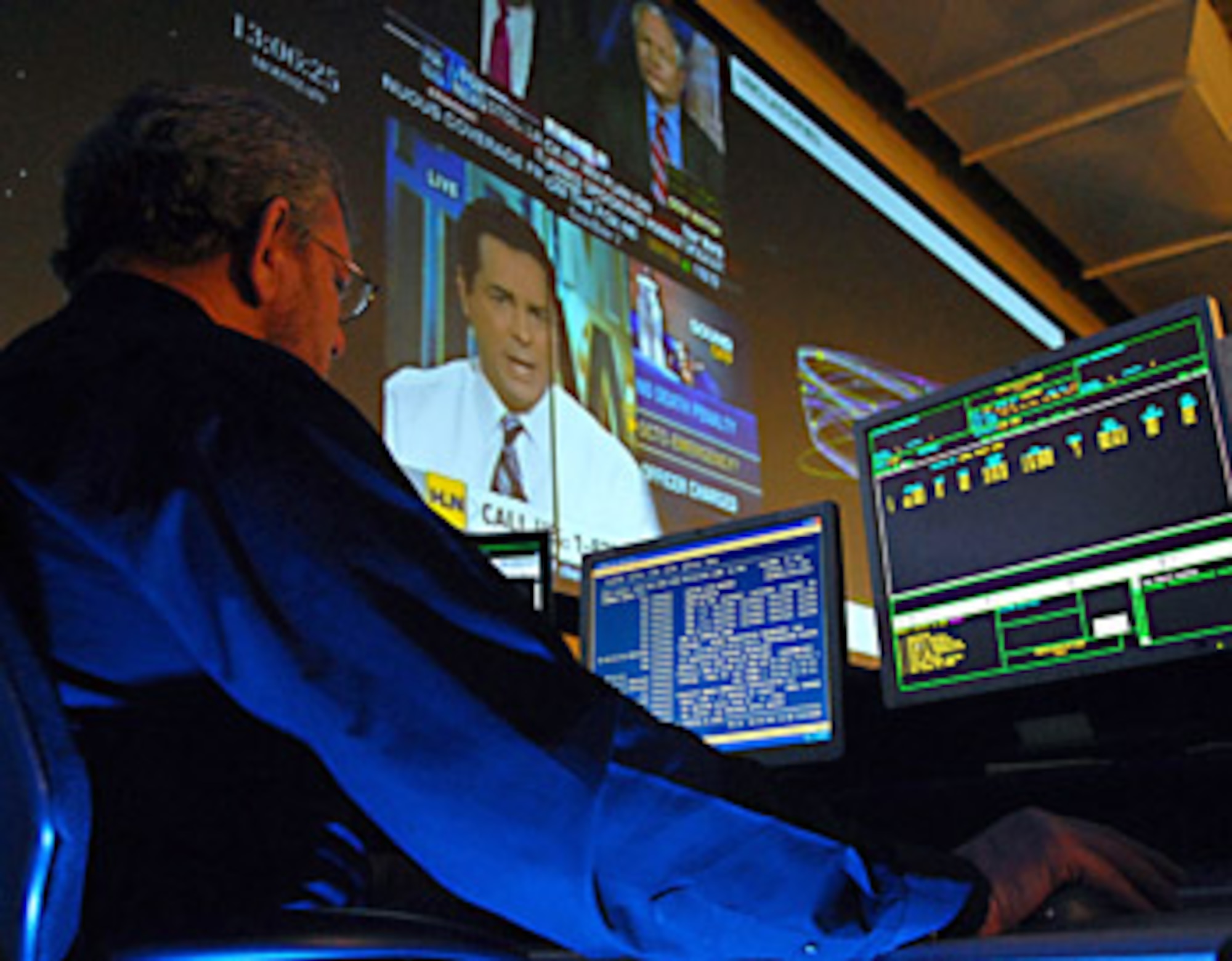 HANSCOM AIR FORCE BASE, Mass. - Paul McMeekin, a system program analyst at the Joint Space Operations Center at Vandenberg Air Force Base, Calif., reviews received data. The JSpOC provides a focal point for the operational employment of worldwide joint space forces, and enables the commander of Joint Functional Component Command Space to integrate space power into global military operations. The Electronic Systems Center's 850th Electronic Systems Group is currently working on developing the acquisition strategy for the JSpOC Mission System.  (Photo by Airman 1st Class Antoinette Lyons) 
