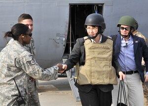 Staff Sgt. Peaches Parker, 447th Air Expeditionary Group Protocol and deployed 316th Force Support Squadron readiness member, left, welcomes U.S. Ambassador Patricia Butenis to the flightline at Sather Air Base, Iraq March 31. (U.S. Air Force photo/ Staff Sgt. Amanda Currier)