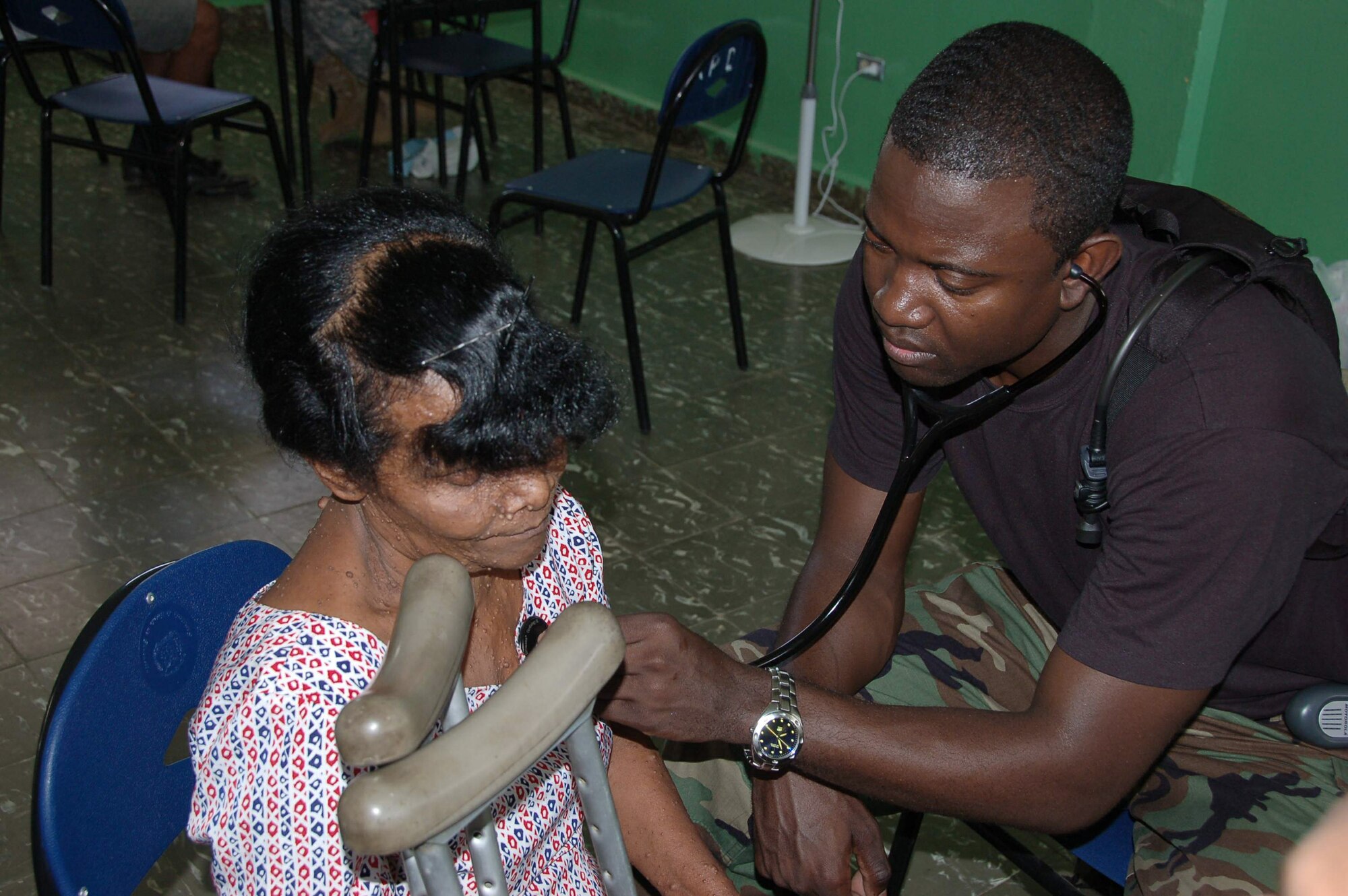 Capt. Keiron T. Kennedy gives a physical exam to a patient with neurofibromatosis, a genetic disorder causing multiple tumors, at a temporary clinic in Hostos, Dom. Rep., April 21, during a medical readiness exercise. The medics treated 1,800 patients during the first two days of the U.S. Southern Command sponsored Beyond the Horizon 2009 - Caribbean. Captain Kennedy is a flight surgeon from the 42nd Medical Group at Maxwell Air Force Base, Ala., (U.S. Air Force photo/Capt. Ben Sakrisson) 