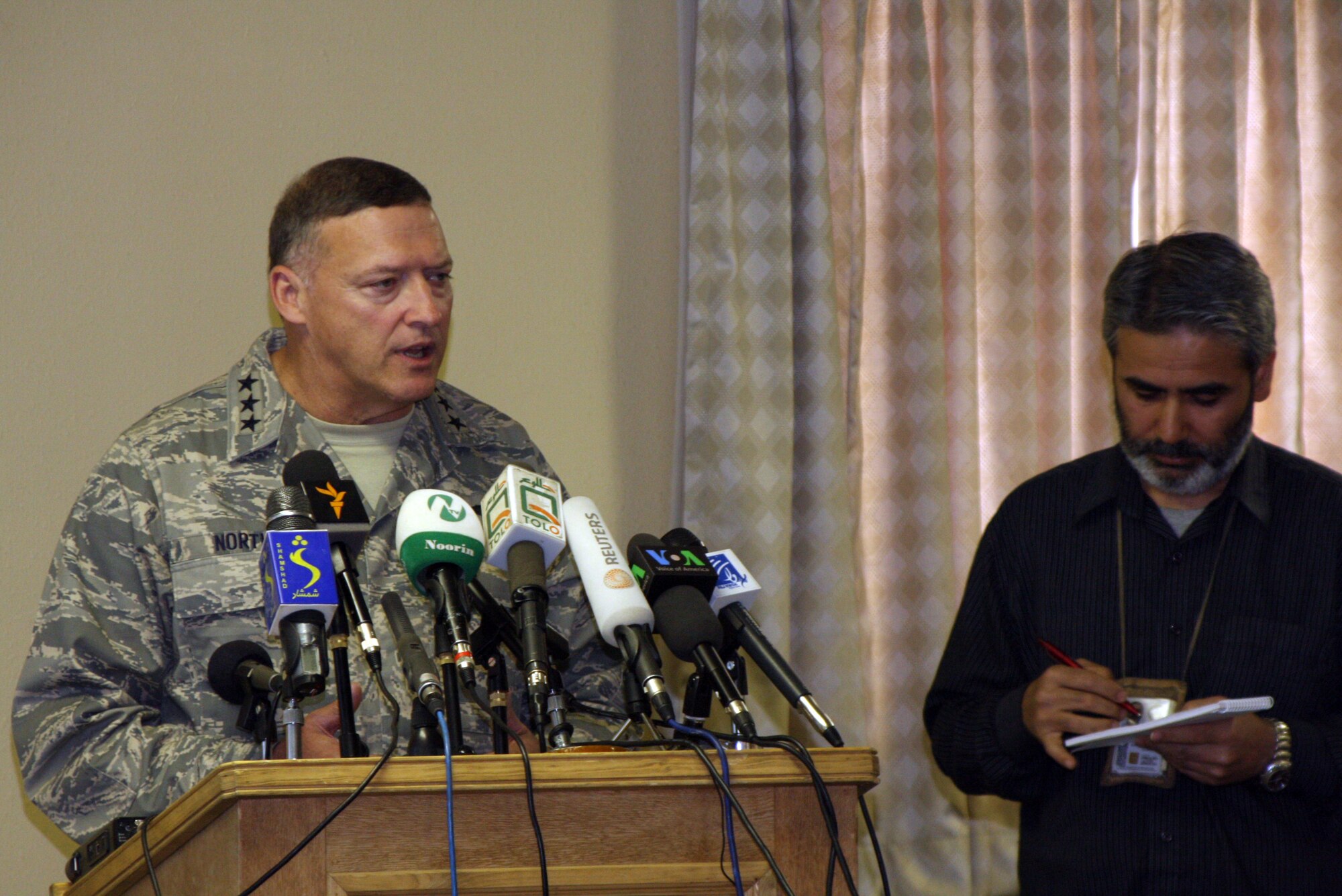 Lt. Gen. Gary North, Combined Forces Air Component Commander (CFACC) for Southwest Asia, answers questions from Afghan media during his news conference during ?Bagram Media Days? April 19, 2009.  During his presentation, General North stressed the significant efforts made to reduce the risk to non-combatants during combat air operations in Afghanistan. (Photo by U.S. Army Capt. Michael Greenberger)