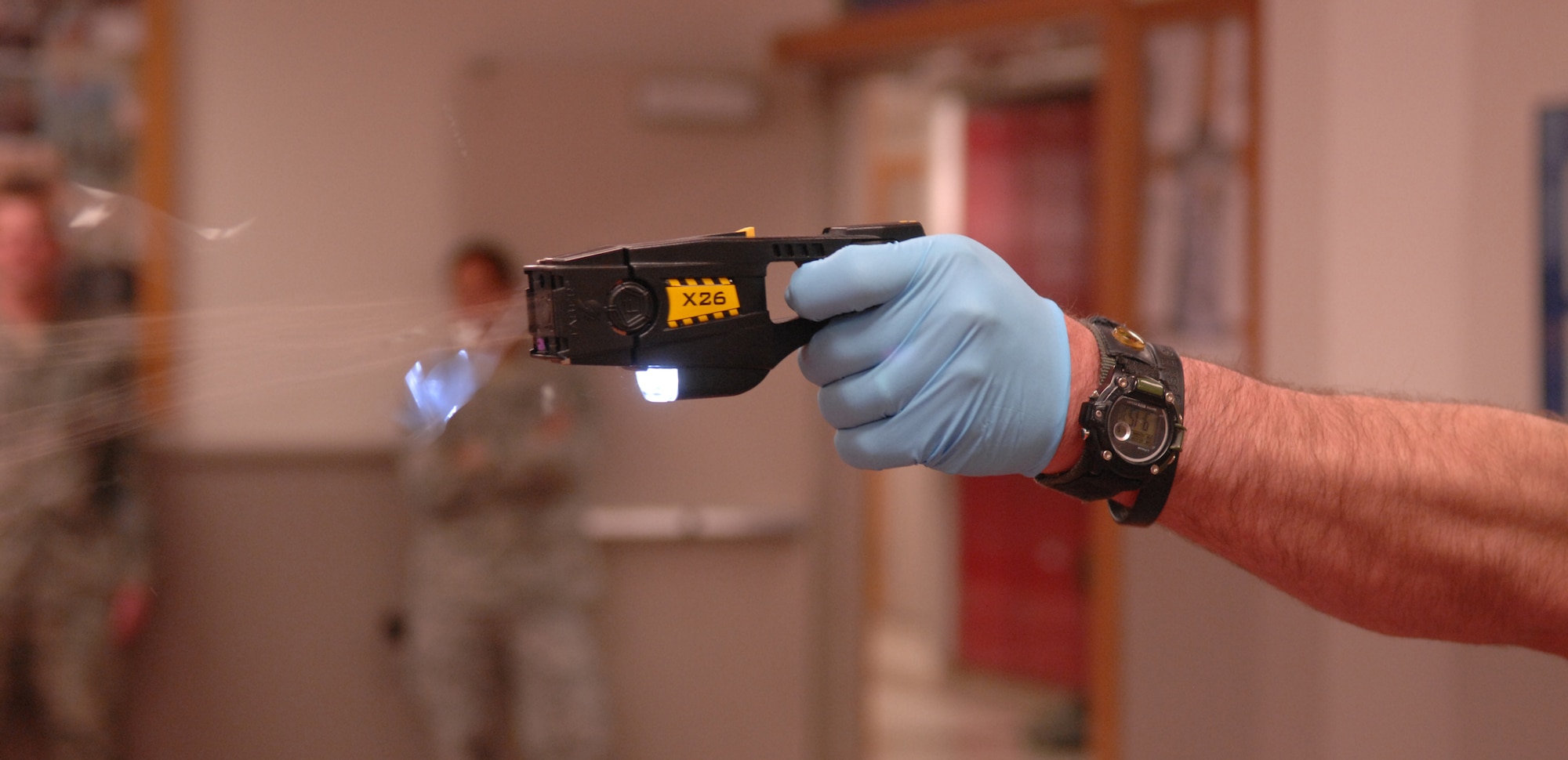WHITEMAN AIR FORCE BASE, Mo. – Billy Matheny, 509th Security Forces Squadron, tases a training participant April 22.  According to Mr. Matheny, the use of the X26 Taser will allow officers to subdue larger, stronger opponents with no long lasting effects while reducing the danger to them selves from having to go hands on with a subject. (U.S. Air Force photo/Senior Airman Stephen Linch)