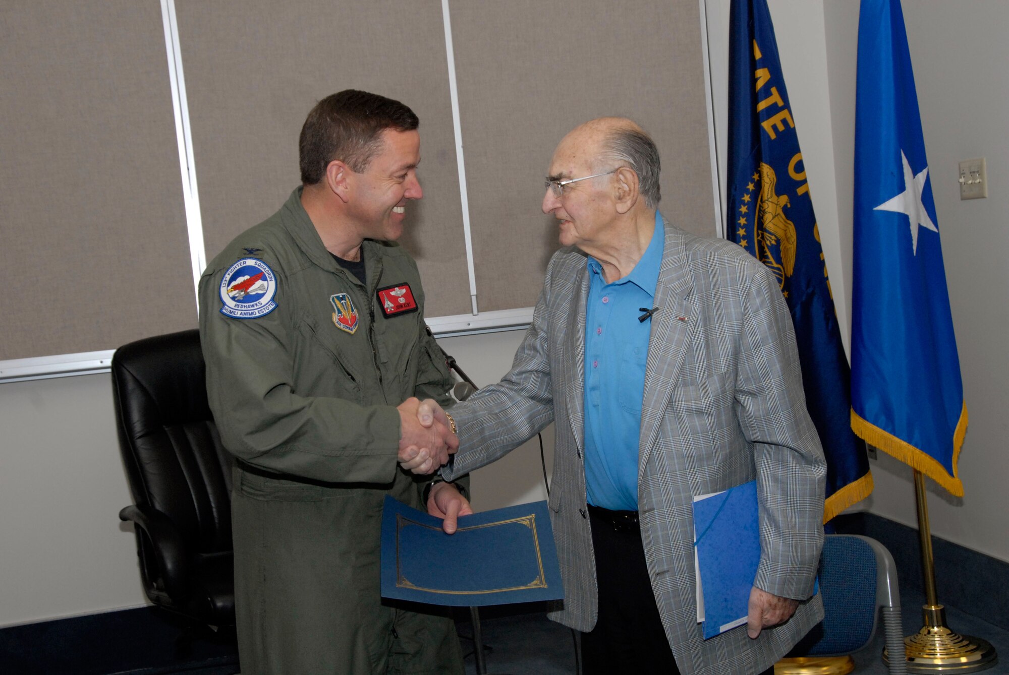 Retired Oregon Air National Guard Brigadier General Fred M. Rosenbaum, meets with Col. John Kent, commander of the 142nd Fighter Wing, following Rosenbaum's presentation on his personal experiences during the Holocaust was the focus of the wing's Diversity Council observances for Holocaust Remembrance Month. (Photo by Staff Sgt. John Hughel, Oregon Air National Guard Public Affairs)