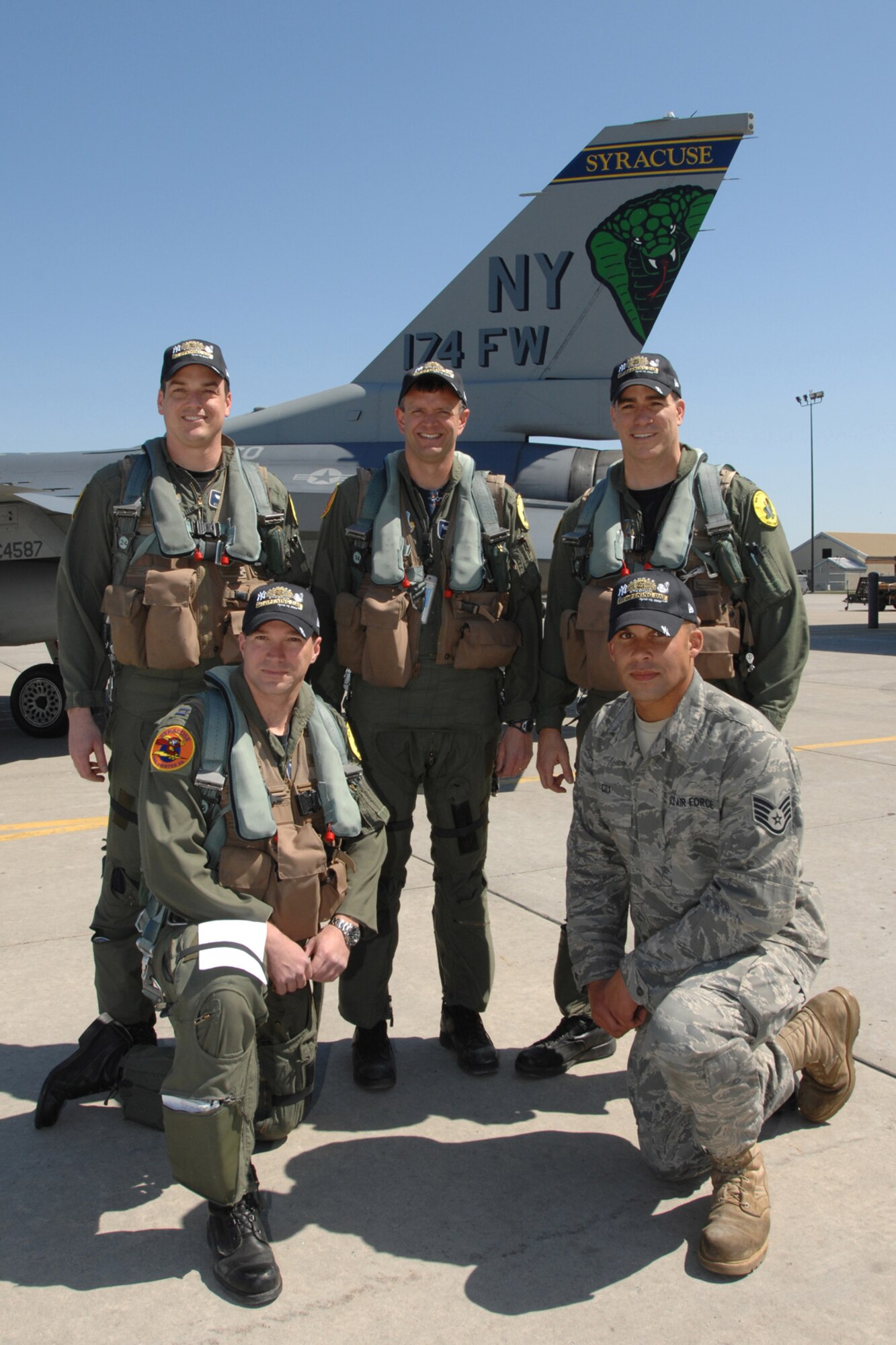 Aircrew members from the 174th Fighter Wing of Syracuse N.Y., pose for a photo after performing the fly-by for the opening day ceremony for the new Yankee Stadium on April 16, 2009. The F-16 Fighting Falcon crew members include bottom row from left to right, Capt. Scott Bissonnette and Staff Sgt. Preston Cox and top row, Maj. Kurt Tongren, Maj. John Knutsen and Lt. Col. Sean McQuaid. (U.S. Air Force photo by SSgt James N. Faso II/RELEASED) 