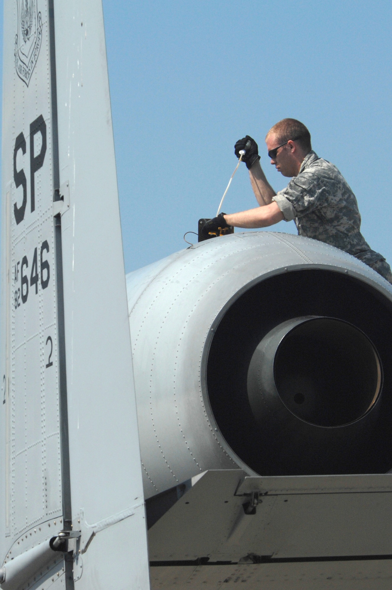 BEZMER AIR BASE, Bulgaria – Airman 1st Class Josh Stubstad, 52nd Equipment Maintenance squadron crew chief, inspects the engine of an 81st Fighter Squadron A-10.  A team of maintenance Airmen deployed to Bezmer Air Base, Bulgaria, to support “Reunion April 2009,” a  joint training exercise. (U.S. Air Force photo by Master Sgt. Bill Gomez) 