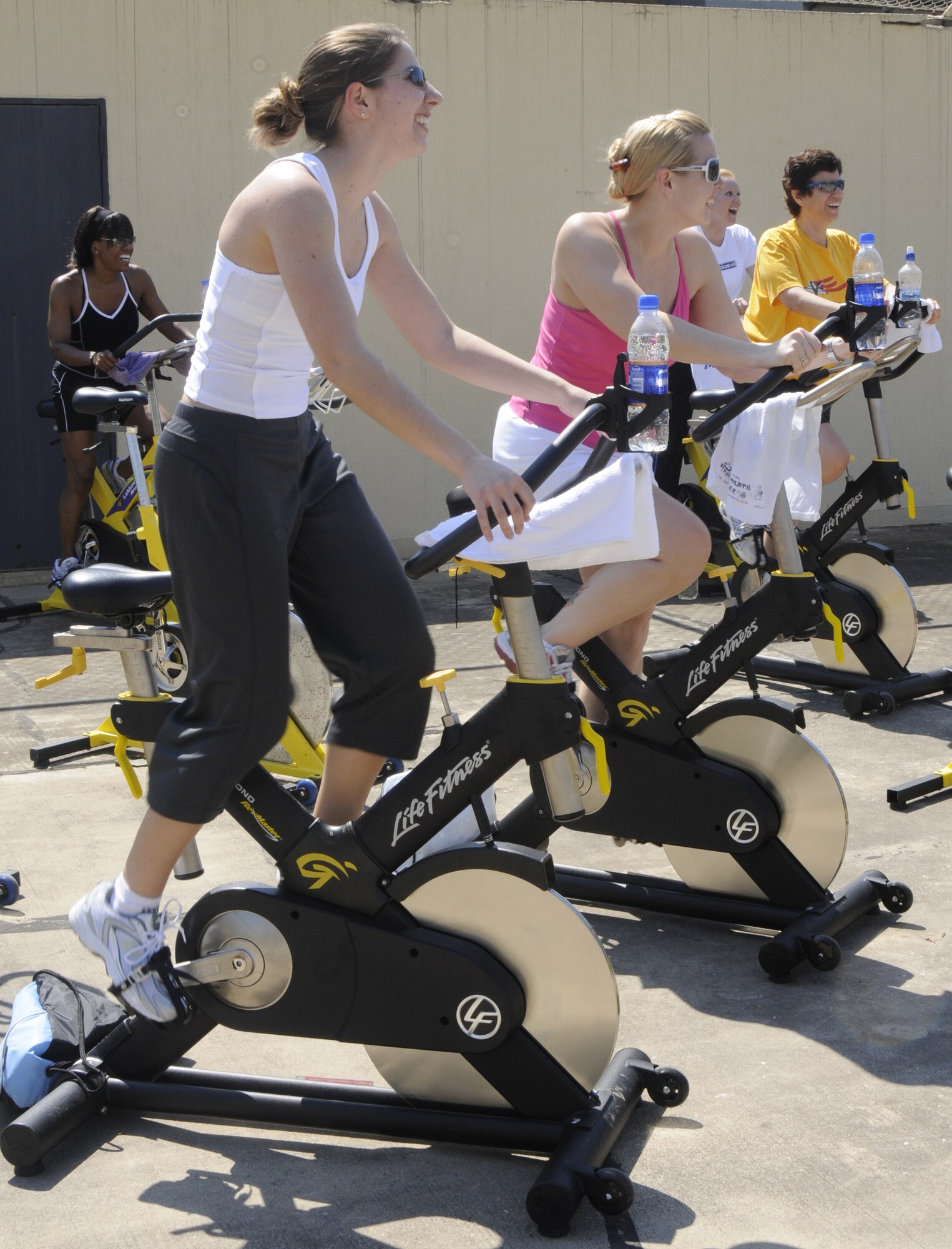 Members of Incirlik Air Base, Turkey, push through the three hour spin-a-thon April 18, 2009 outside the fitness center. The spin-a-thon is held quarterly here, to challenge individuals physically.  The fitness center provides energy bars, fruit and water for the participants during their ride. (U.S. Air Force photo/Airman 1st Class Amber Russell)