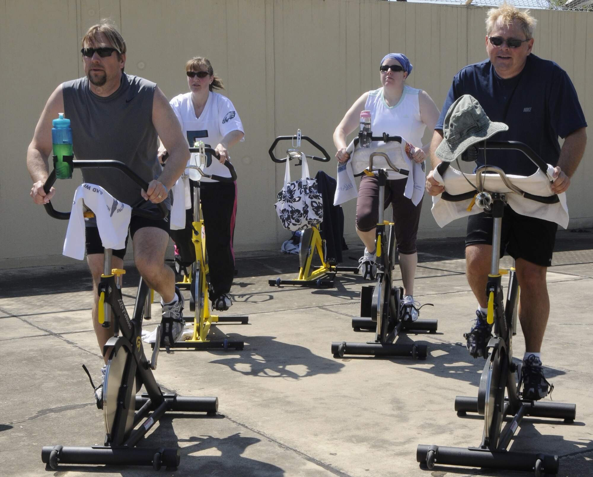 Members of Incirlik Air Base, Turkey, push through the three hour spin-a-thon April 18, 2009 outside the fitness center. The spin-a-thon is held quarterly here, to challenge individuals physically.  The fitness center provides energy bars, fruit and water for the participants during their ride. (U.S. Air Force photo/Airman 1st Class Amber Russell)