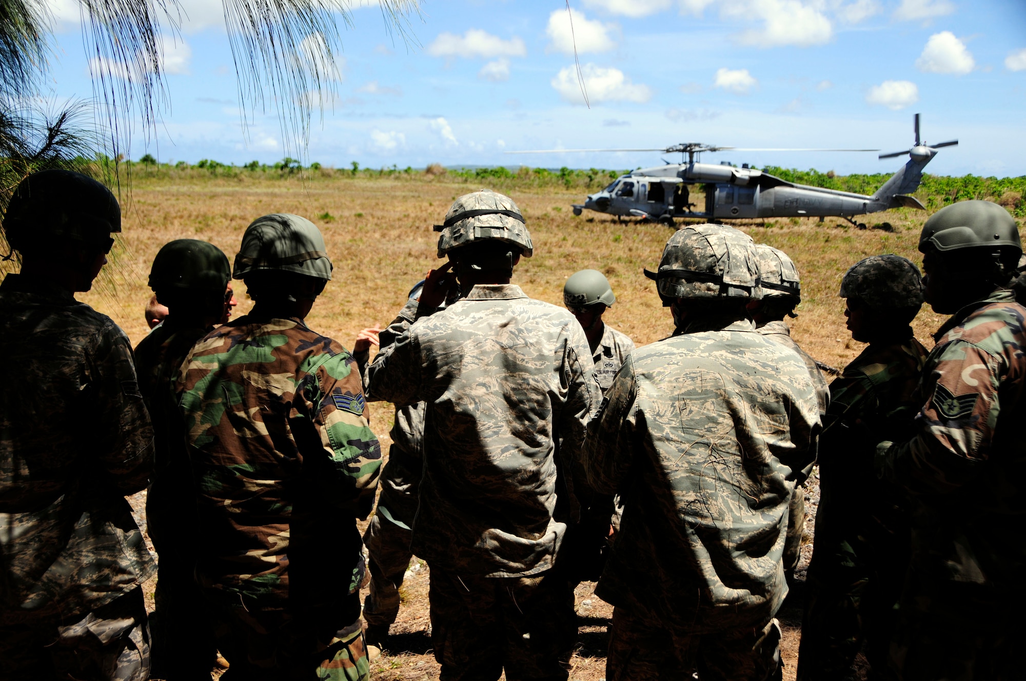 ANDERSEN AIR FORCE BASE, Guam -  The 554th RED HORSE aero-team gather around for last minute overview of what to expect during their training at Northwest Field April 22. The Rapid Engineer Deployable Heavy Operations Repair Squadron Engineer participated in a two day field training exercise to hone expeditionary skills to open a base in any environment. (U.S. Air Force photo by Airman 1st Class Courtney Witt)