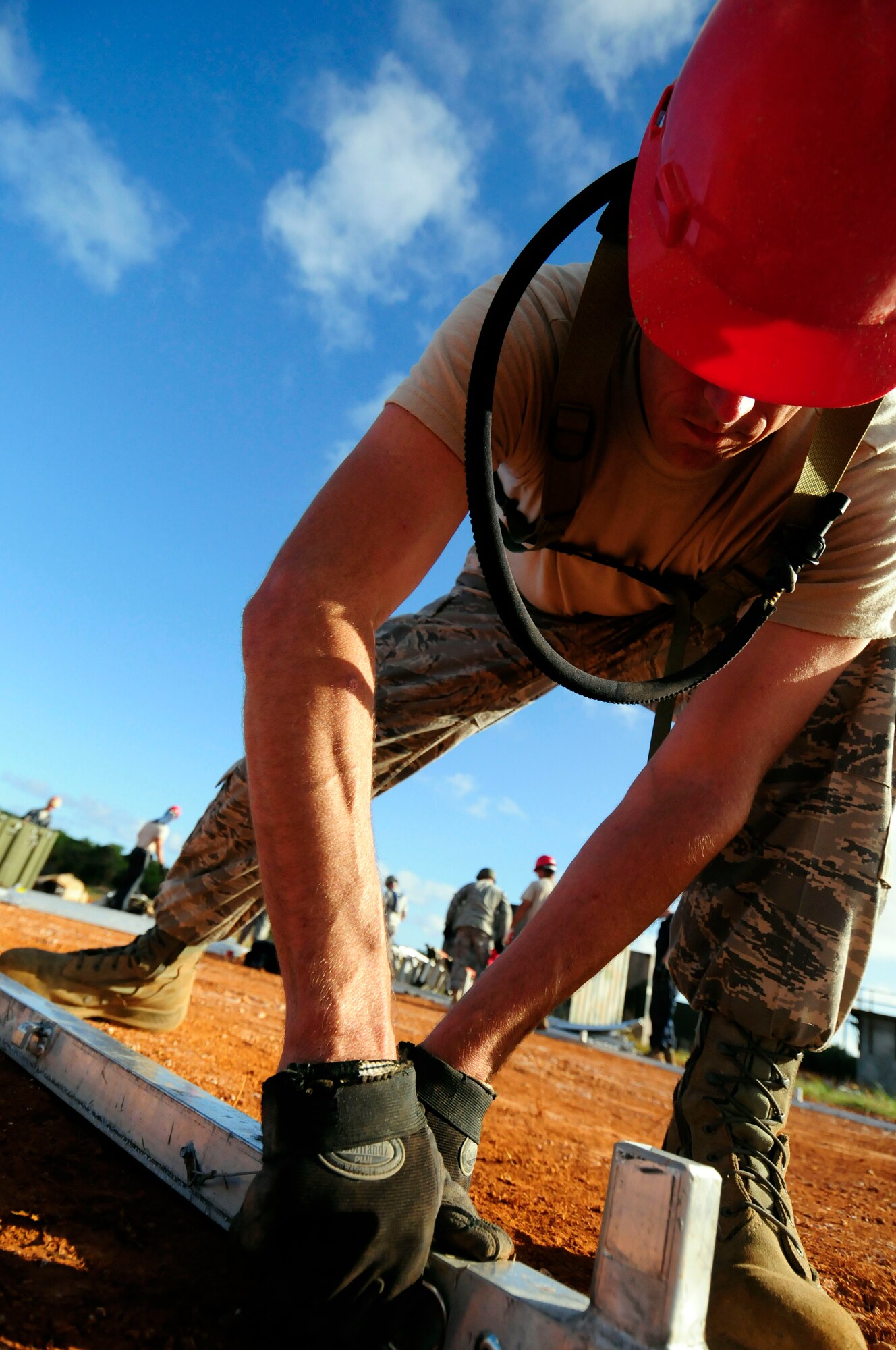 ANDERSEN AIR FORCE BASE, Guam - Staff Sgt. Stephen Johnson, 554th RED HORSE Structural Craftsman, puts together framework for one of 12 tents during the field training exercise at Northwest Field April 22. The Rapid Engineer Deployable Heavy Operations Repair Squadron Engineer participated in a two day field training exercise to hone expeditionary skills to open a base in any environment. (U.S. Air Force photo by Airman 1st Class Courtney Witt)
