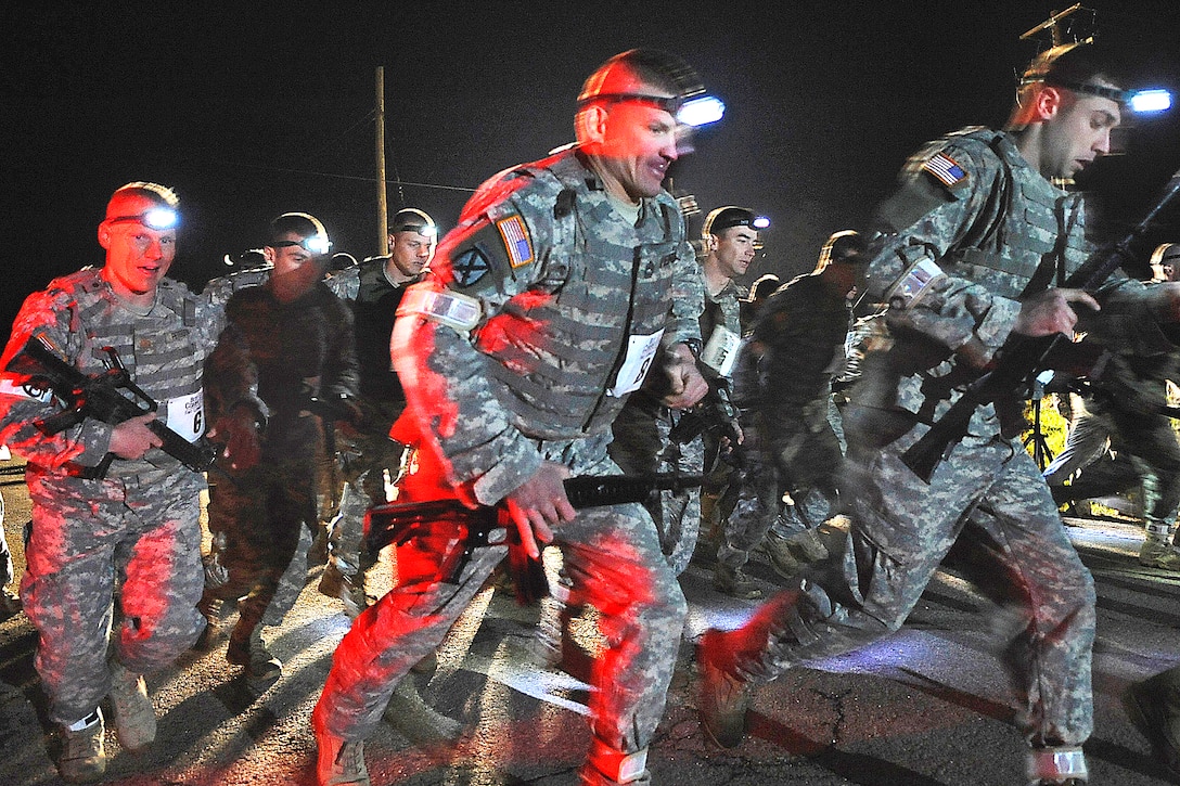 U.S. Army soldiers begin a three-mile buddy run while geared in Kevlar and flak jackets during phase one of the physical training test for the 2009 Best Sapper Competition on Fort Leonard Wood, Mo., April 20, 2009. The annual event, which consists of six phases over 52 hours, is held for Army combat engineers to compete for the title of Best Sapper and determine th best engineers.