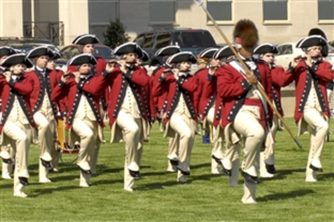U.S. Army Old Guard Fife and Drum Corps marches during a full honor arrival ceremony for King Abdullah ll, who was greeted by Defense Secretary Robert M. Gates at the Pentagon, April 24, 2009. King Abdullah, ruler of the Hashemite Kingdom of Jordan, and Gates met to discuss a range of regional security issues.  