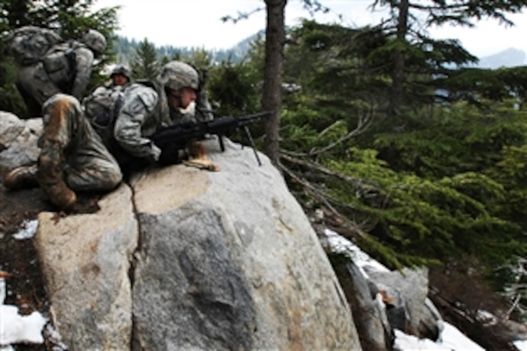 U.S. soldiers establish a patrol base during Operation Viper Shake in the mountains surrounding Korengal Valley, Afghanistan, April 21, 2009. The troops are assigned to the1st Infantry Division's Company C, 1st Battalion, 26th Infantry Regiment.