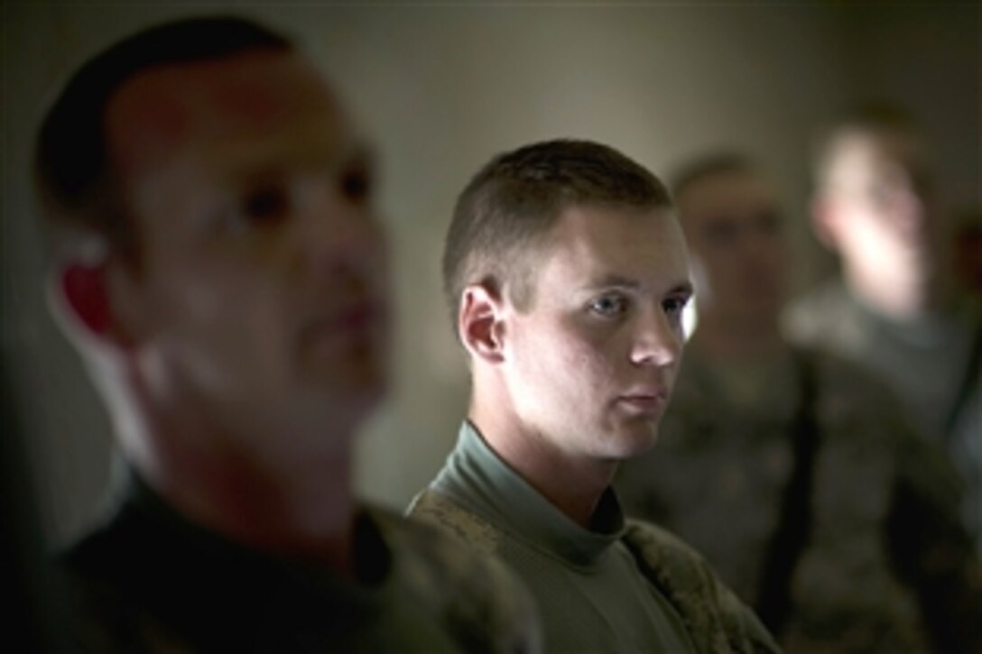 U.S Army Spc. Matthew Hillman listens as U.S. Navy Adm. Mike Mullen, chairman of the Joint Chiefs of Staff, conducts an all-hands call with soldiers assigned to Forward Operating Base Walton, Zabul province, Afghanistan, April 24, 2009. Mullen is on a six-day tour of the U.S. Central Command area of responsibility to escort a USO tour, meet with counterparts and visit troops. 