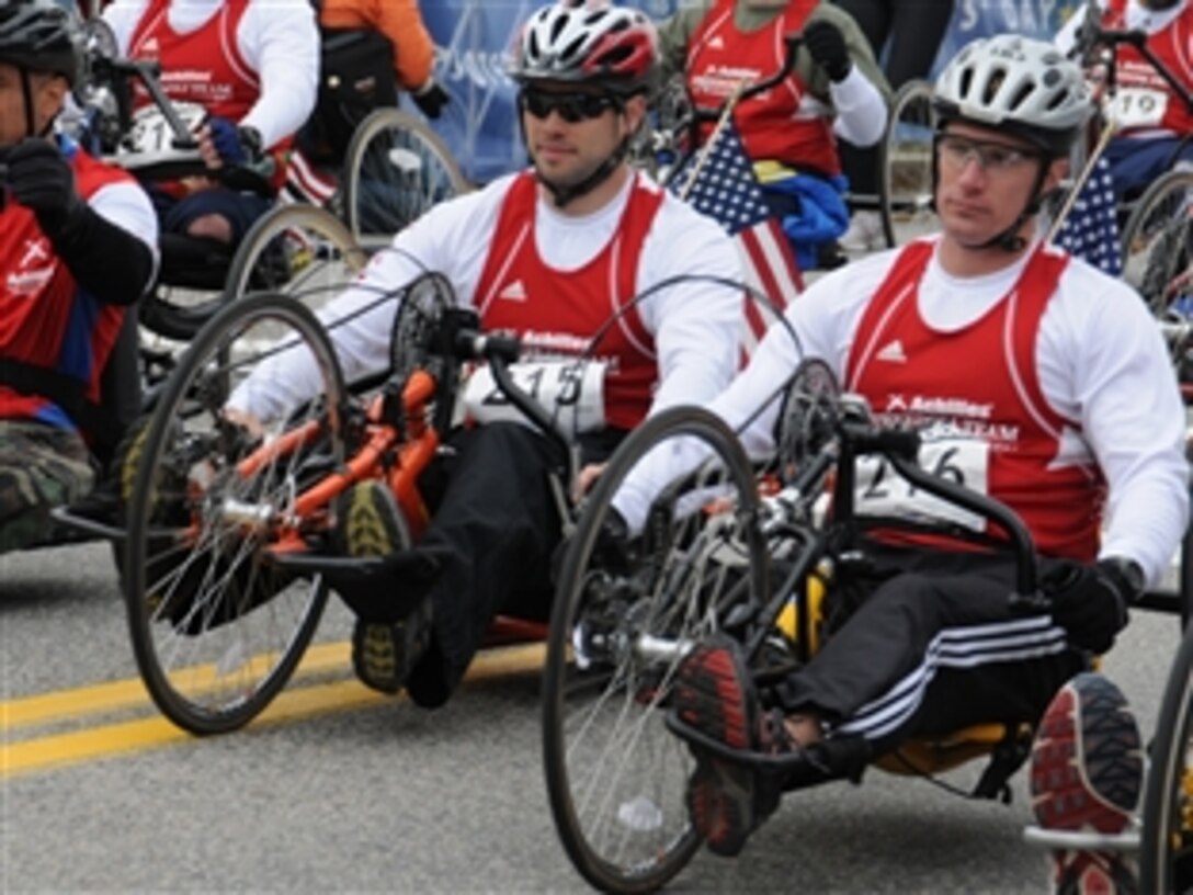 Special Forces soldiers Army Staff Sgt. John Walding and Army Maj. Kent Solheim, both wounded warriors, start the 113th Boston Marathon together, April 20, 2009. 