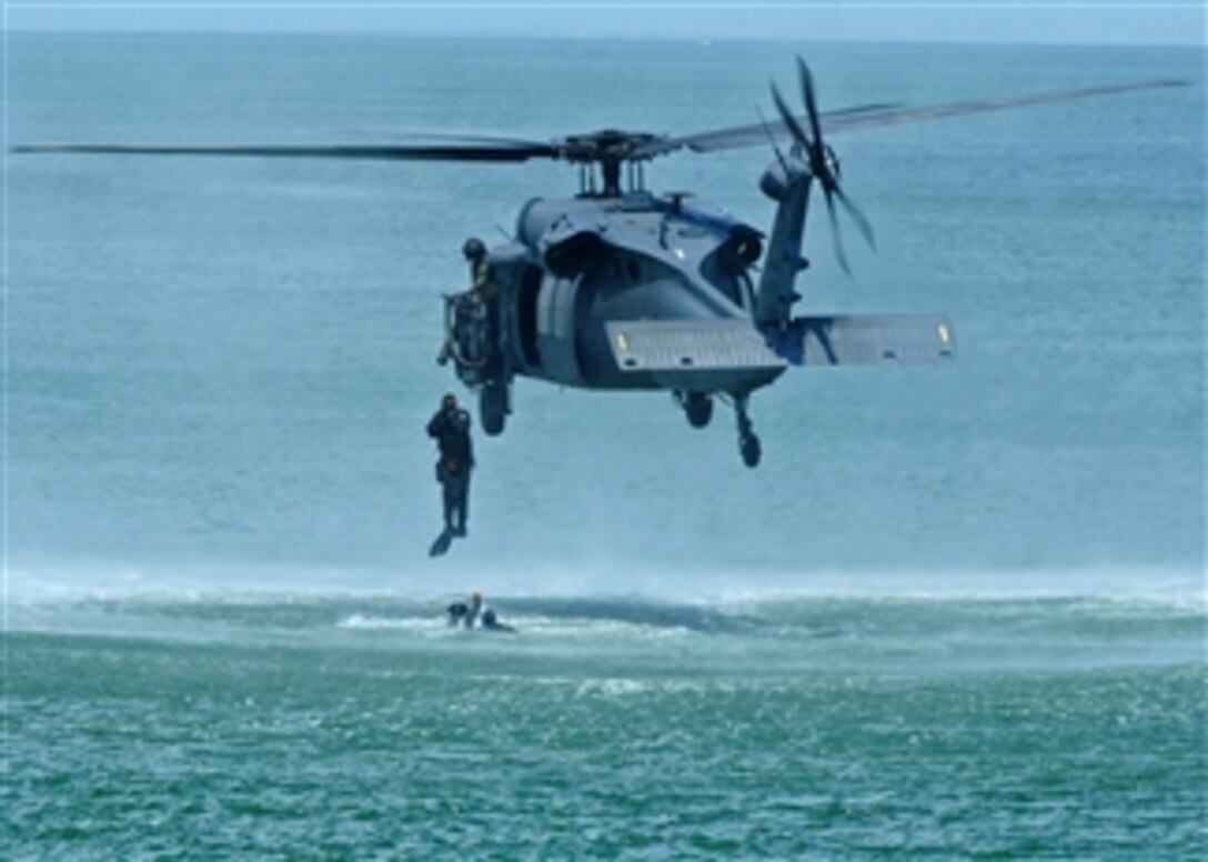 U.S. Air Force 38th Rescue Squadron pararescuemen from Moody Air Force Base, Ga., jump from a 41st Rescue Squadron HH-60G Pave Hawk helicopter during the Joint Air Power Demonstration at the Virginia Beach boardwalk in Hampton Roads, Va., on April 22, 2009.  The demonstration showcased the critical role air power plays in the joint fight and is one of many events occurring during Hampton Roads Air Force Week.  