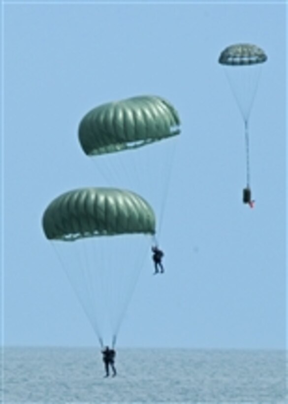 U.S. Air Force pararescuemen from the 38th Rescue Squadron out of Moody Air Force Base, Ga., perform a joint air power demonstration at the Virginia Beach boardwalk in Hampton Roads, Va., on April 22, 2009.  The demonstration, which was held as a part of Air Force Week, showcased the critical role air power plays in the joint fight.  