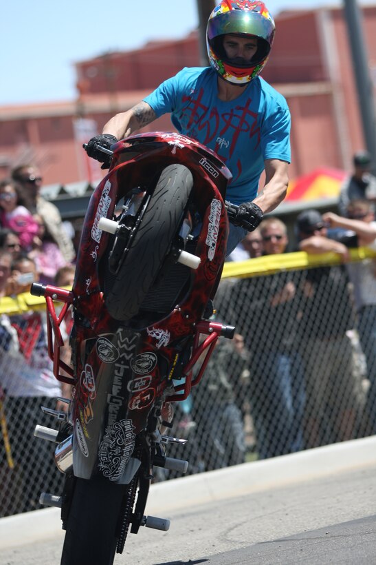 Jef Groff, a stunt rider, rides a wheelie in circles during The Few, The Proud, The Xtreme show at Victory Field April 25.