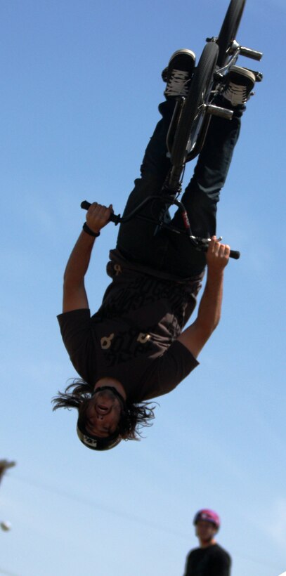 A rider with Creative Sports Inc. goes head over heels for the crowd while performing at The Few, The Proud, The Xtreme show at Victory Field April 25.