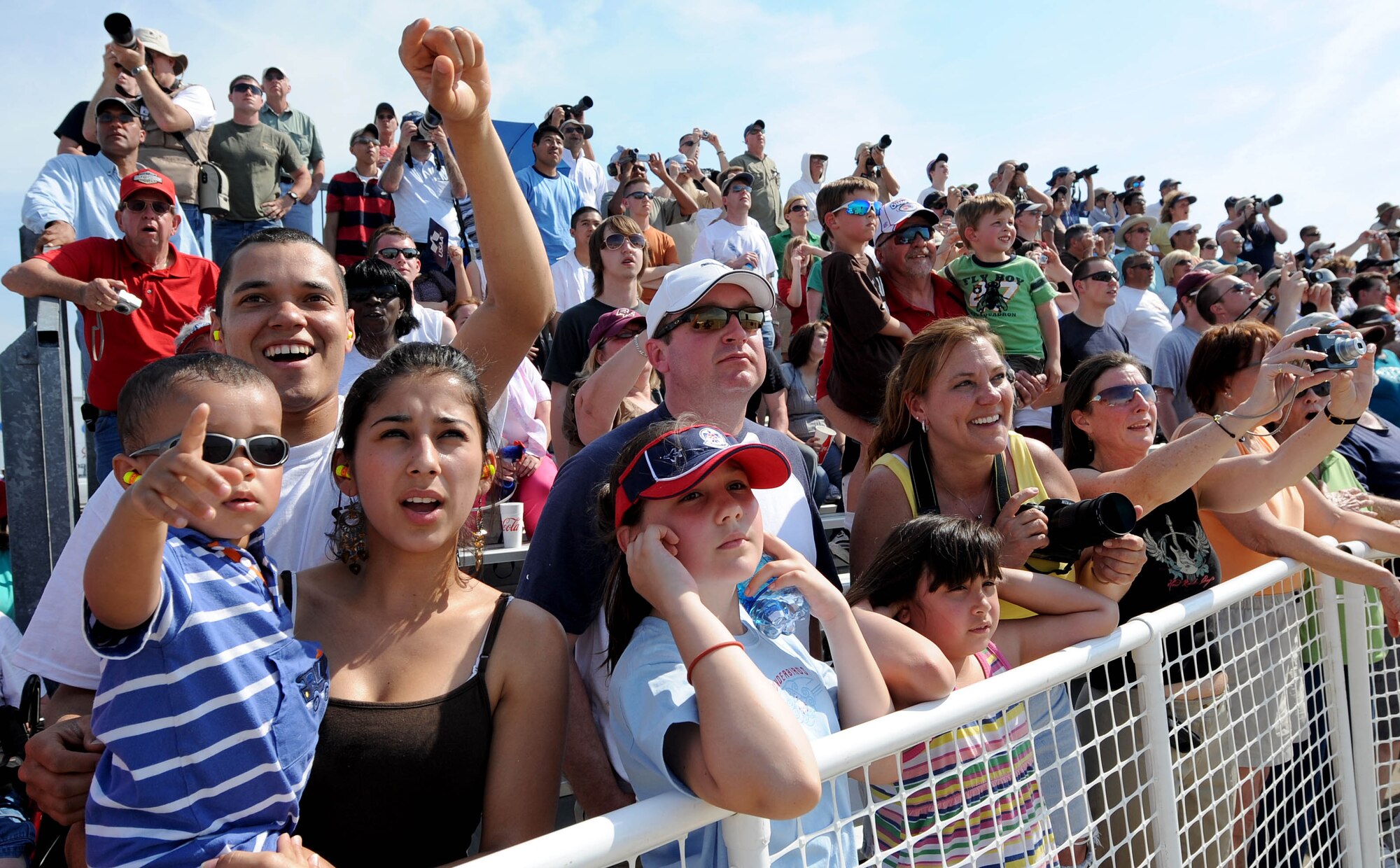 LANGLEY AIR FORCE BASE, Va. -- The crowd cheers as The U.S. Air Force Air Demonstration Squadron, "Thunderbirds," perform during AirPower over Hampton Roads April 25. This annual event helps educate the public on Air Force capabilities, increase recruiting and show appreciation to the local community. (U.S. Air Force photo/Airman Rebecca Montez)