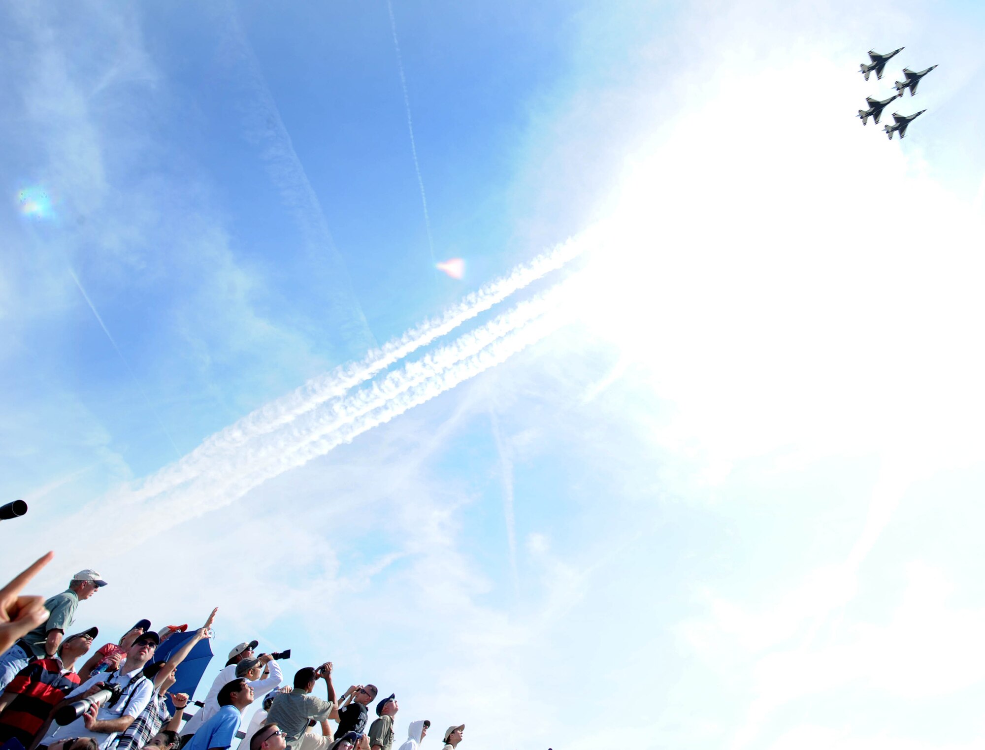 LANGLEY AIR FORCE BASE, Va. -- Crowds point as four F-16 Thunderbirds perform during AirPower over Hampton Roads April 25. This annual event helps educate the public on Air Force capabilities, increase recruiting and show appreciation to the local community. (U.S. Air Force photo/Airman Rebecca Montez)