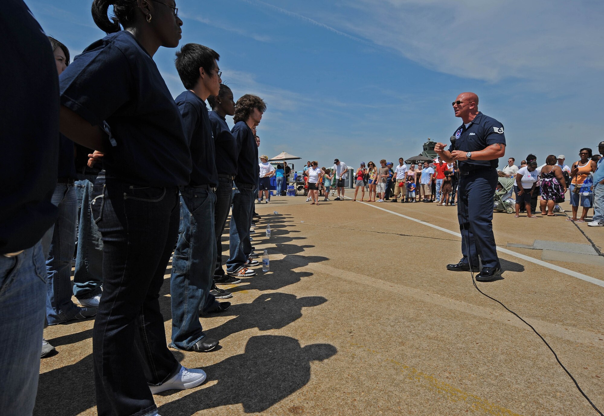 LANGLEY AIR FORCE BASE, Va. -- Staff Sgt. Jason Wildman, a recruiter with The United States Air Force Air Demonstration Squadron, the Thunderbirds, briefs Delayed Entry Program participants prior to the Enlistment Ceremony at AirPower over Hampton Roads April 25. This annual event helps educate the public on Air Force capabilities, increase recruiting and show appreciation to the local community. (U.S. Air Force photo/Airman Rebecca Montez)