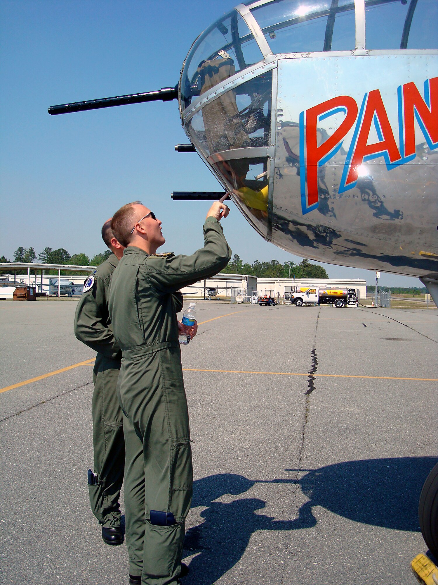 Lieutenant Col. Todd Canterbury, 334th Fighter Squadron commander, and Lt. Col. Thomas Colby, 4th Training Squadron commander, look at "Panchito," the B-25J Mitchell Bomber that will perform at Wings Over Wayne air show here Saturday and Sunday, April 25 and 26. (U.S. Air Force photo by Capt. Kristen Duncan)