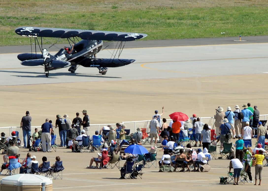 LANGLEY AIR FORCE BASE, Va. -- Kyle Franklin waves to the crowd after his performance in a Waco Biplane during AirPower over Hampton Roads here April 25. This annual event helps educate the public on Air Force capabilities, increase recruiting and show appreciation to the local community.(U.S. Air Force photo/Airman 1st Class Jonathan Koob) 