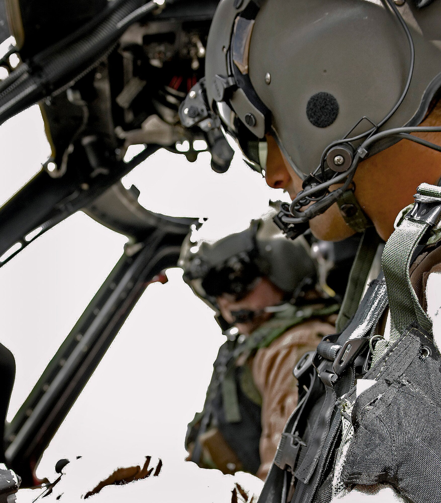 Lt. Col. Eugene Sengstacken, 101st Expeditionary Rescue Squadron commander, and Capt. Tamar Hassan, 101st ERQS co-pilot, start up the engines on a HH-60 Pave Hawk before taking off on a training mission here April 20. (Air Force/Staff Sgt. Jason Lake)