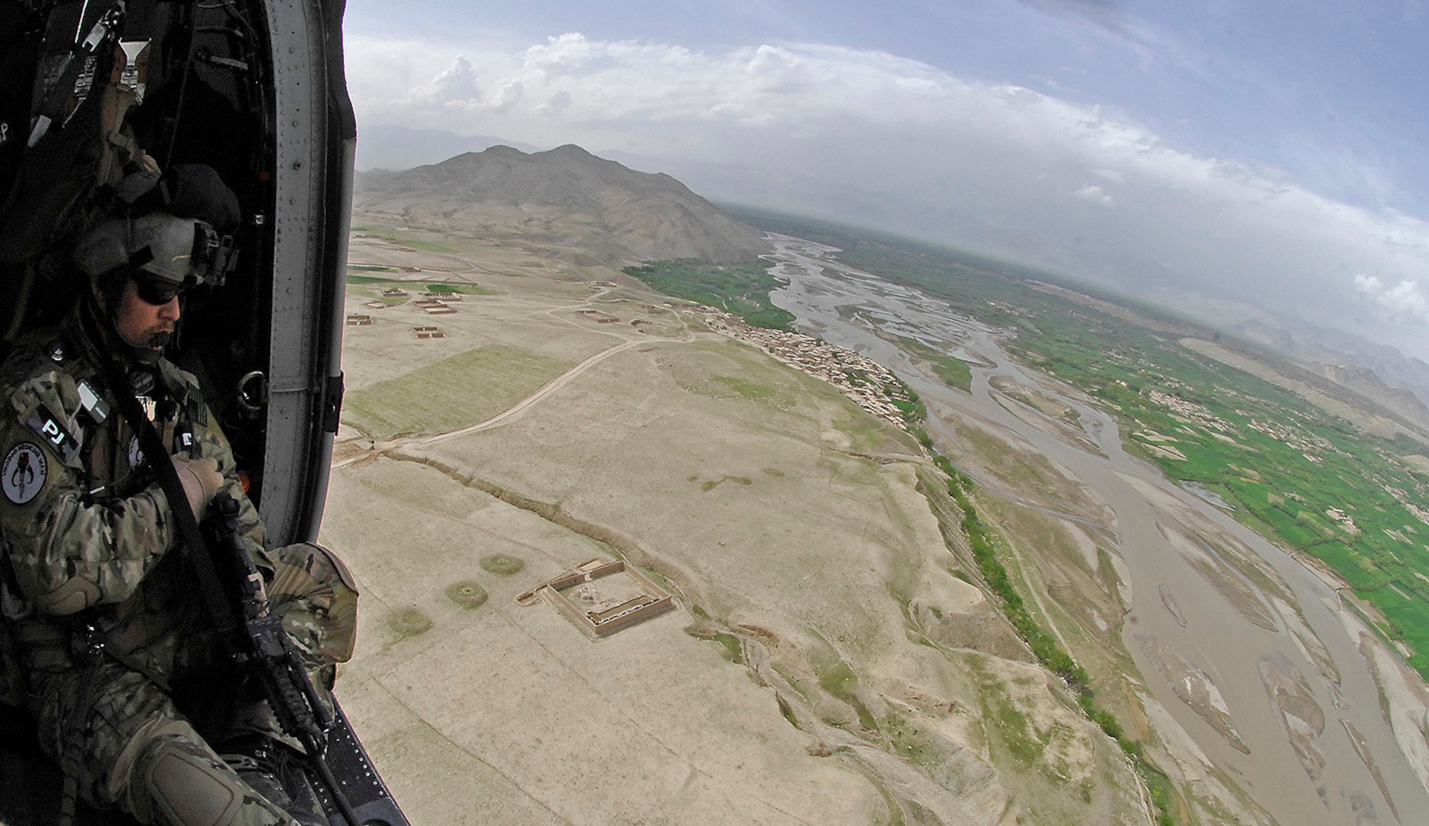 Tech. Sgt. Jedediah Smith, 101st Expeditionary Rescue Squadron pararescueman, surveys the landscape for threats during a training mission in Northeastern Afghanistan April 20. (Air Force/Staff Sgt. Jason Lake)