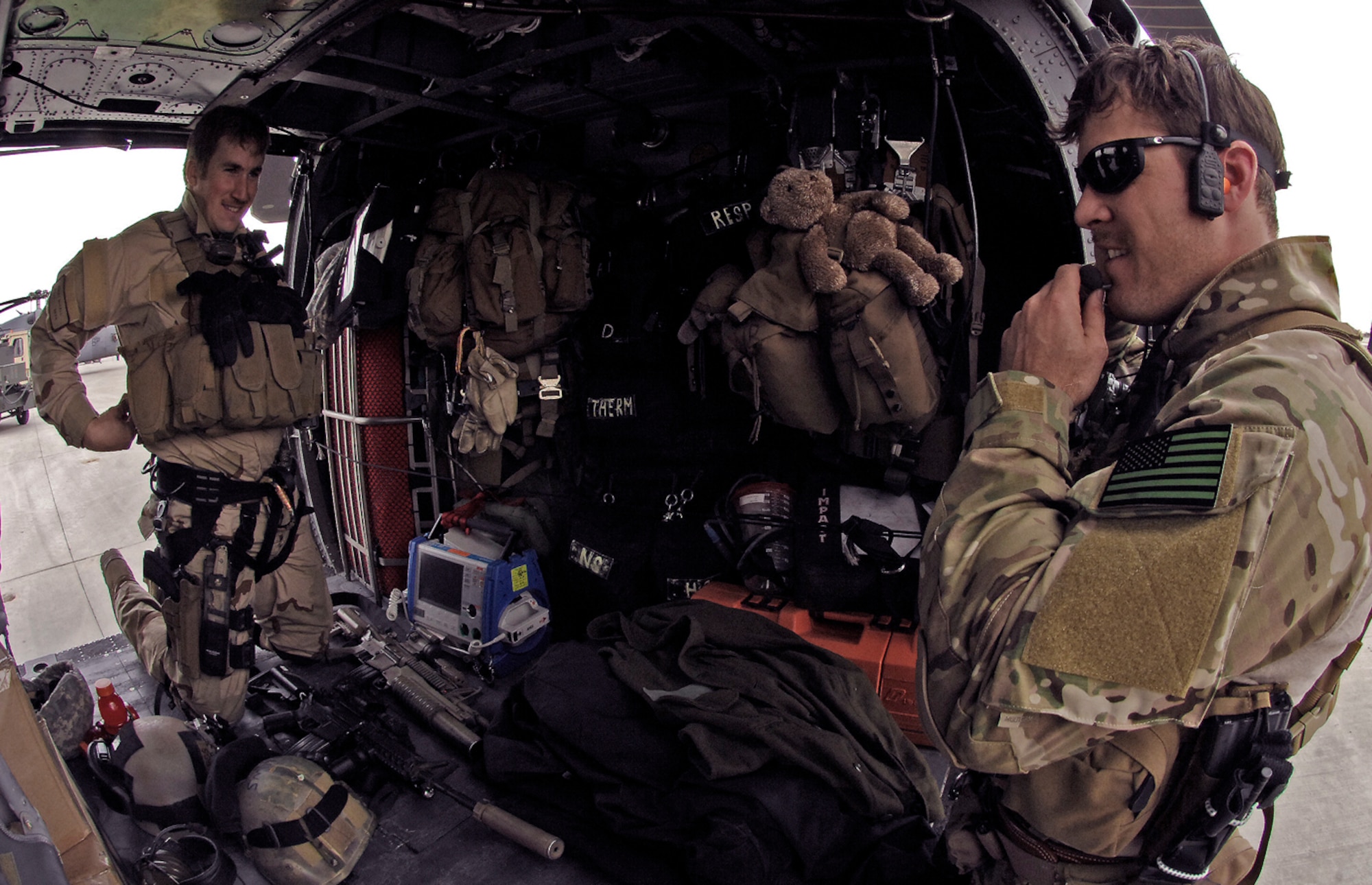 First Lt. Brent McCall, 101st Expeditionary Rescue Squadron combat rescue officer, and Tech. Sgt. Jedediah Smith, 101st ERQS pararescueman, load up their gear for a training mission in Northeastern Afghanistan, April 20. In addition to an M-4 assault rifle, combat medical gear and body armor, Sergeant Smith also packs his four-year-old daughter Mia's pre-school class teddy bear. The seven-year New York Air National Guardsman said he brings the stuffed animal along with him on all his missions and writes letters to her school on behalf of the bear. "He pretty much goes everywhere I go," Sergeant Smith said, including the eight combat search and rescue missions. (Air Force/Staff Sgt. Jason Lake)