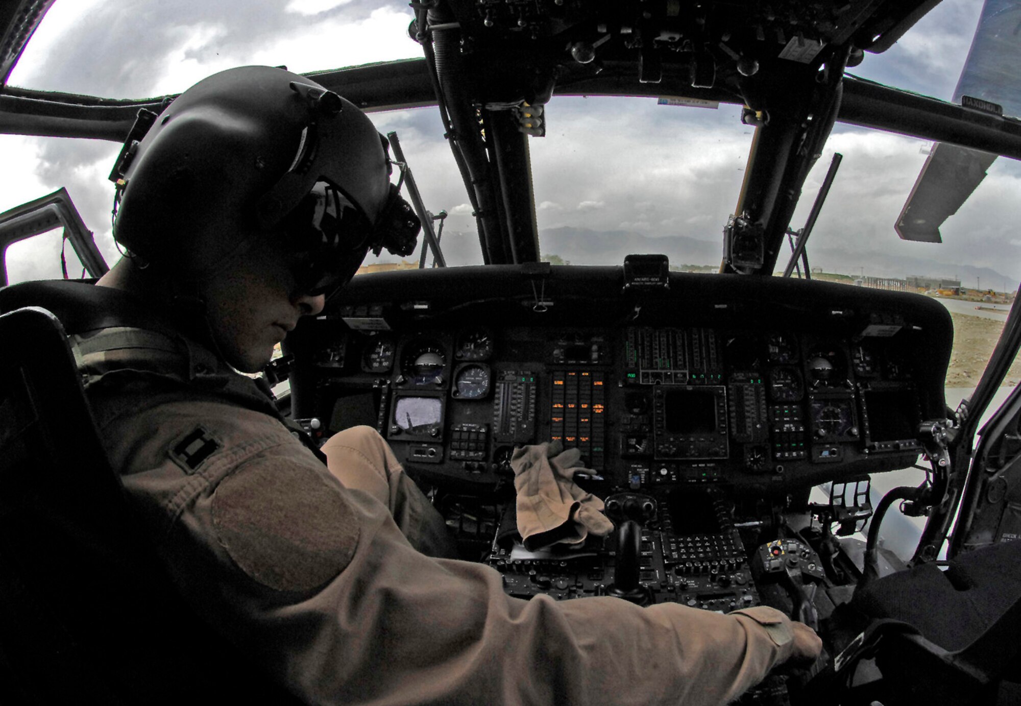 Capt. Tamar Hassan, 101st Expeditionary Rescue Squadron pilot, conducts pre-flight checks on an HH-60 Pave Hawk prior to a training mission here April 20. The 101st ERQS, deployed here from West Hampton Beach, N.Y., provides combat search and rescue capability for the 455th Air Expeditionary Wing. (Air Force/Staff Sgt. Jason Lake)