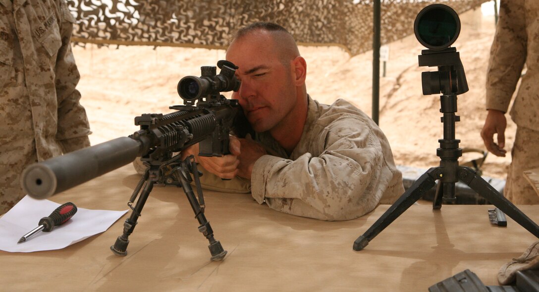 Chief Warrant Officer Christian Wade, battalion gunner for 3rd Light Armored Reconnaissance Battalion adjusts the scope on a Mark-12 designated marksman rifle during a live-fire exercise at Sahl Sinjar, Iraq, April 27, 2009.  Wade says the medium tactical scope is a key factor in making the Mark-12 such an accurate weapon.
