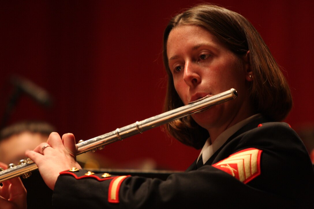 Sgt. Kathryn Ableidinger, a flutist with the Combat Center band, performs during Sunday’s Coats of Red and Blue concert at the Sunset Cinema.