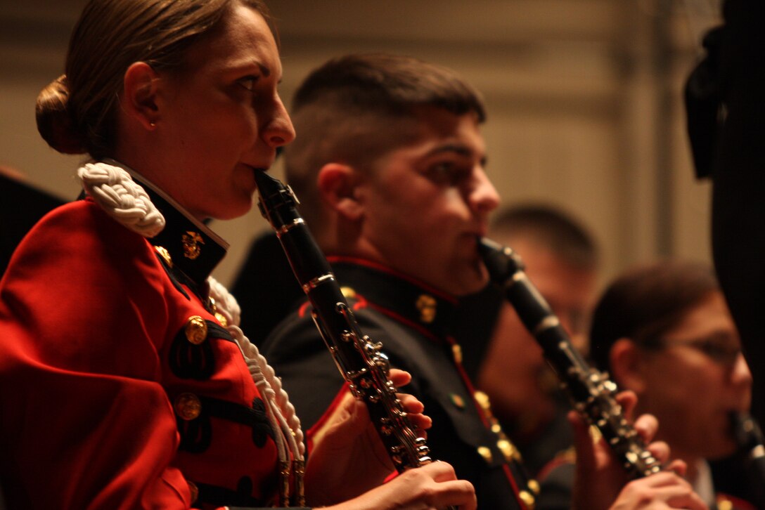 Staff Sgt. Wendy Bickford, a clarinetist with “The President’s Own United States Marine Band, performs during the Coats of Red and Blue 2 concert at the Sunset Cinema Sunday.