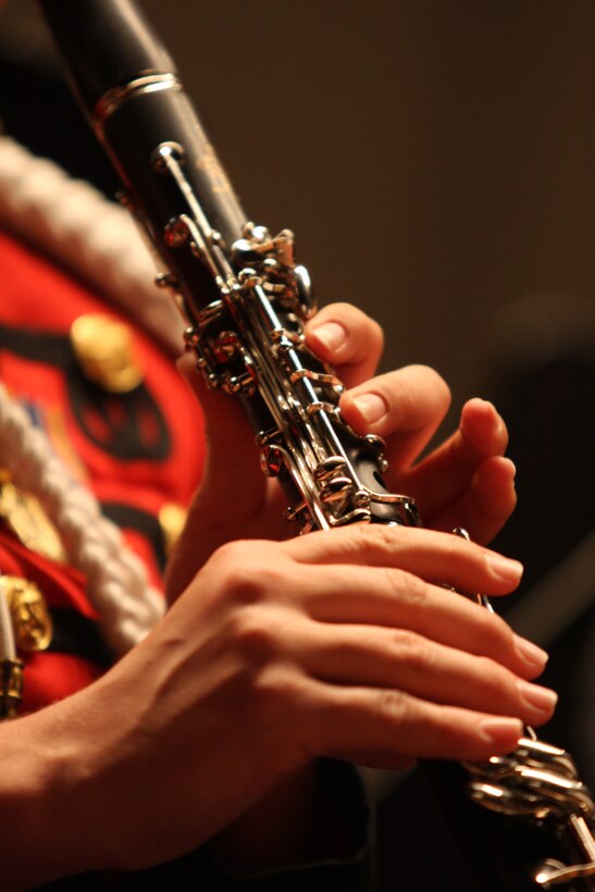 Staff Sgt. Wendy Bickford, a clarinetist with “The President’s Own” United States Marine Band, performs during the Coats of Red and Blue 2 concert at the Sunset Cinema Sunday.
