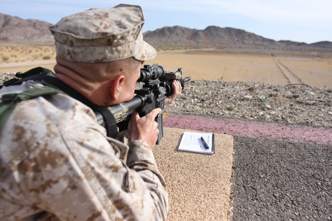 Cpl. Grady Harmon, a tank technician with Company C, 1st Tank Battalion, sights in on his target during the most recent Combat Marksmanship Coaches Course here April 27.